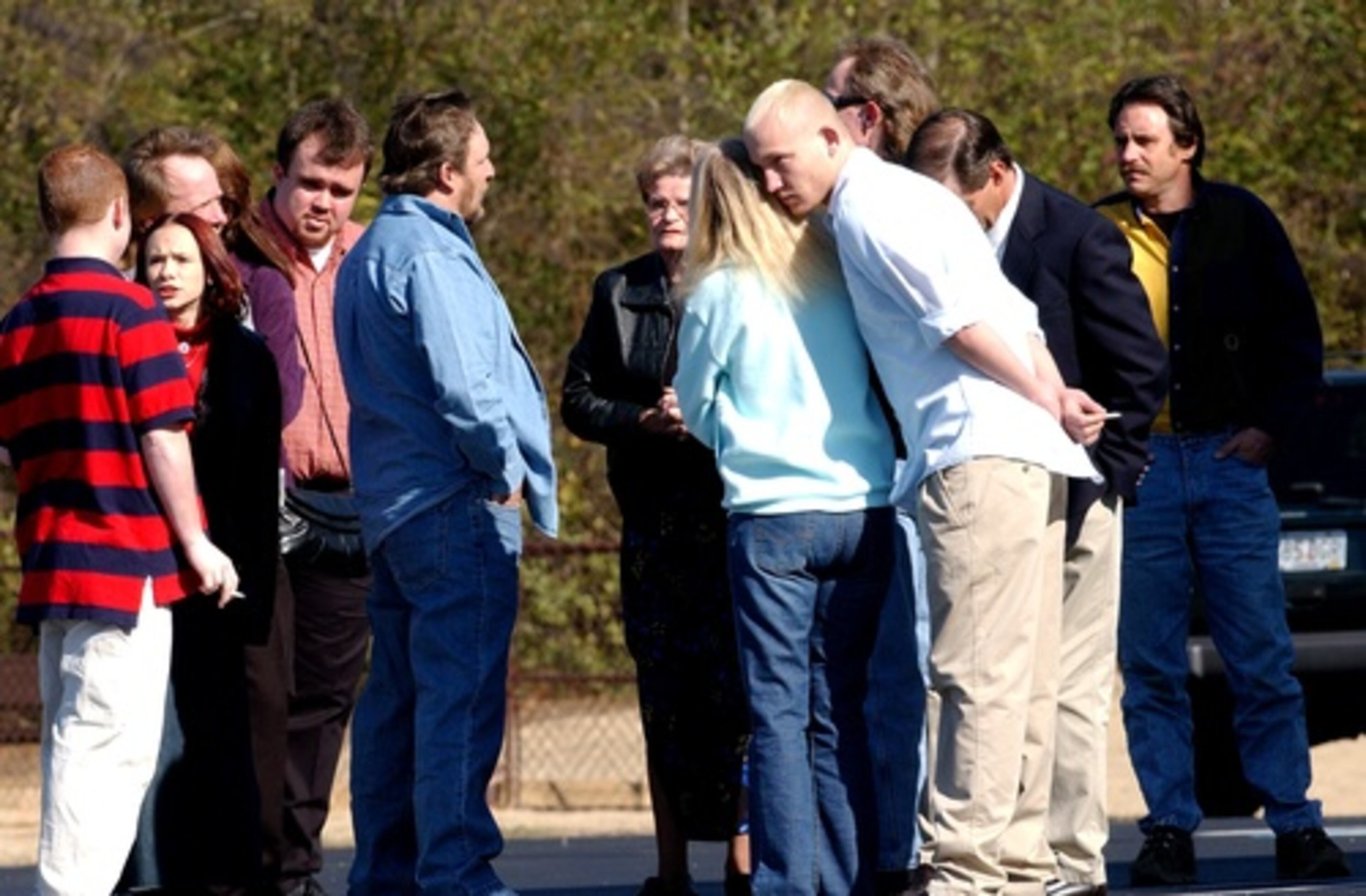 January 2004: Family and friends of murder victims outside Trinity Baptist Church in Gordon County.