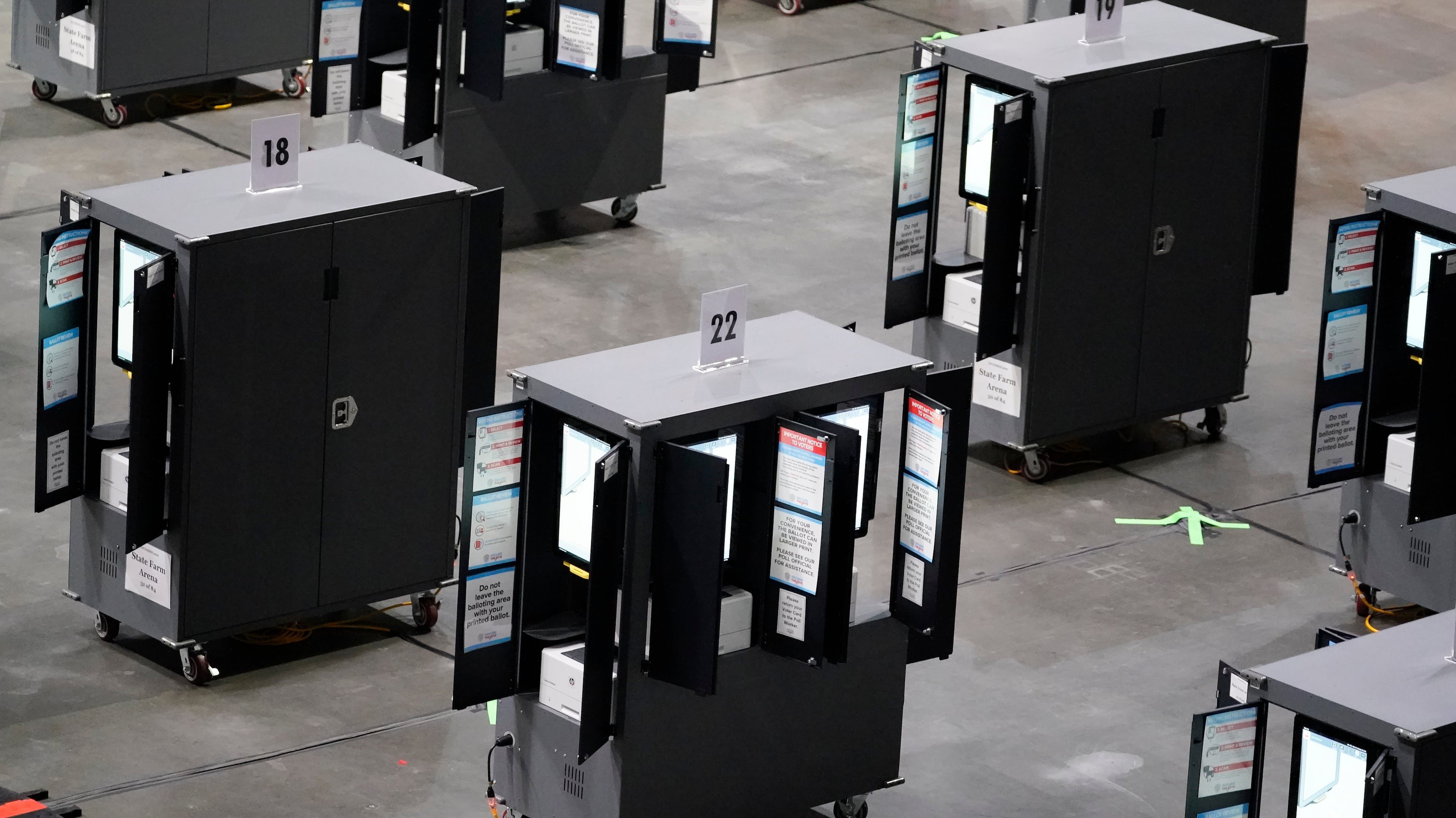 FILE - Voting machines fill the floor for early voting at State Farm Arena, Oct. 12, 2020, in Atlanta. (AP Photo/Brynn Anderson, File)