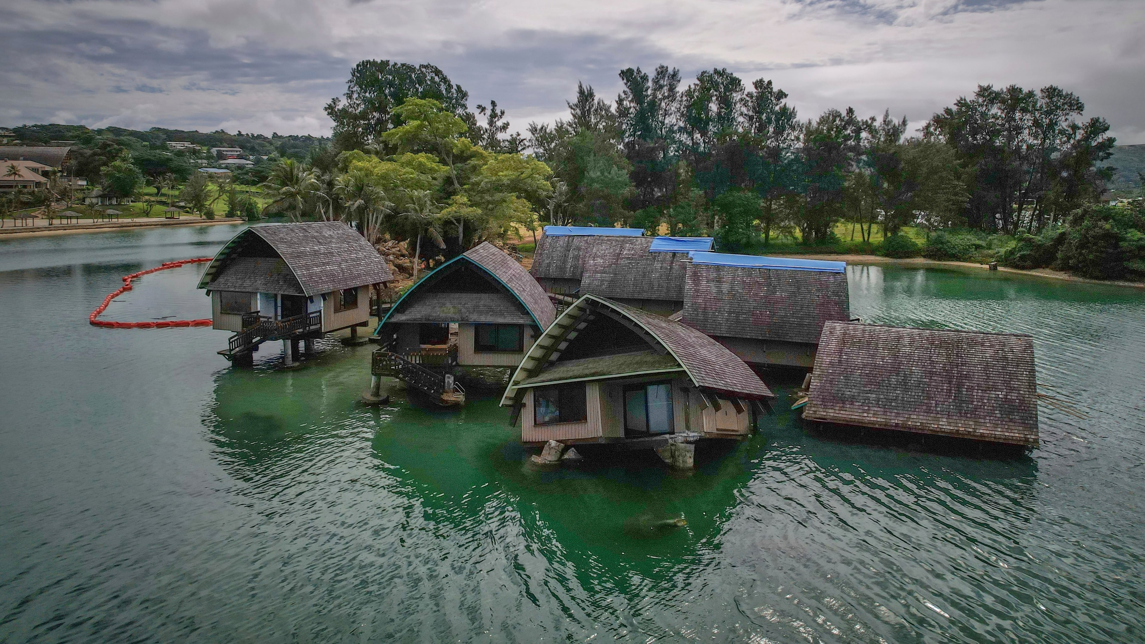 FILE - The once iconic Holiday Inn villas in Port Vila, Vanuatu, sit partially sunken, July 19, 2025, after being hit by multiple cyclones and an earthquake that caused irreparable damage. (AP Photo/Annika Hammerschlag, File