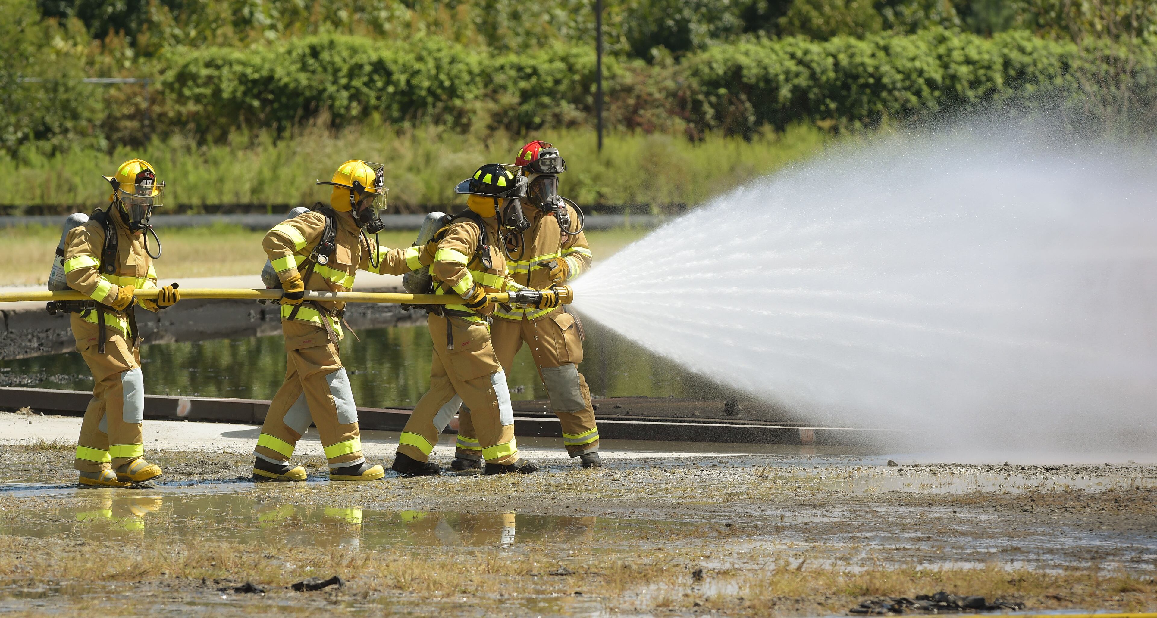 SEPTEMBER 14, 2015 ATLANTA Atlanta Fire Rescue Department firefighters hosted live fire training for attendees at the Aircraft Rescue Fire Fighting (ARFF) Conference, Monday, September, 14, 2015. Firefighters from across the world, battled a simulated fire in an engine and landing gear and also a cascade fire with wing and fuel tanks. Firefighters were Atlanta this week for the 26th Annual ARFF Working Group Conference and Educational Symposium. One of the highlights of the conference was the live fire training at the Hartsfield-Jackson firefighter training site. KENT D. JOHNSON/KDJOHNSON@AJC.COM
