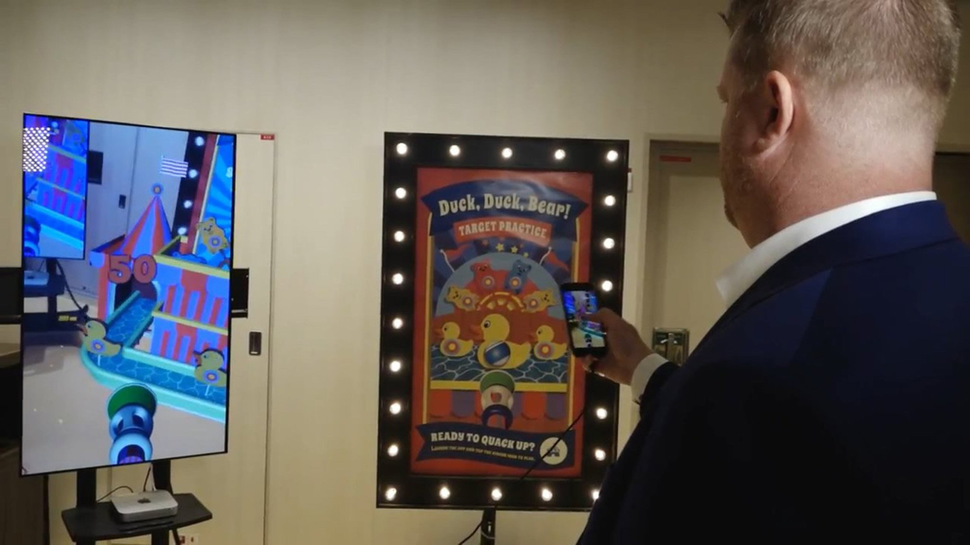 Tim Klauda plays Royal Caribbean augmented reality games on iPhone. (Handout/TNS)