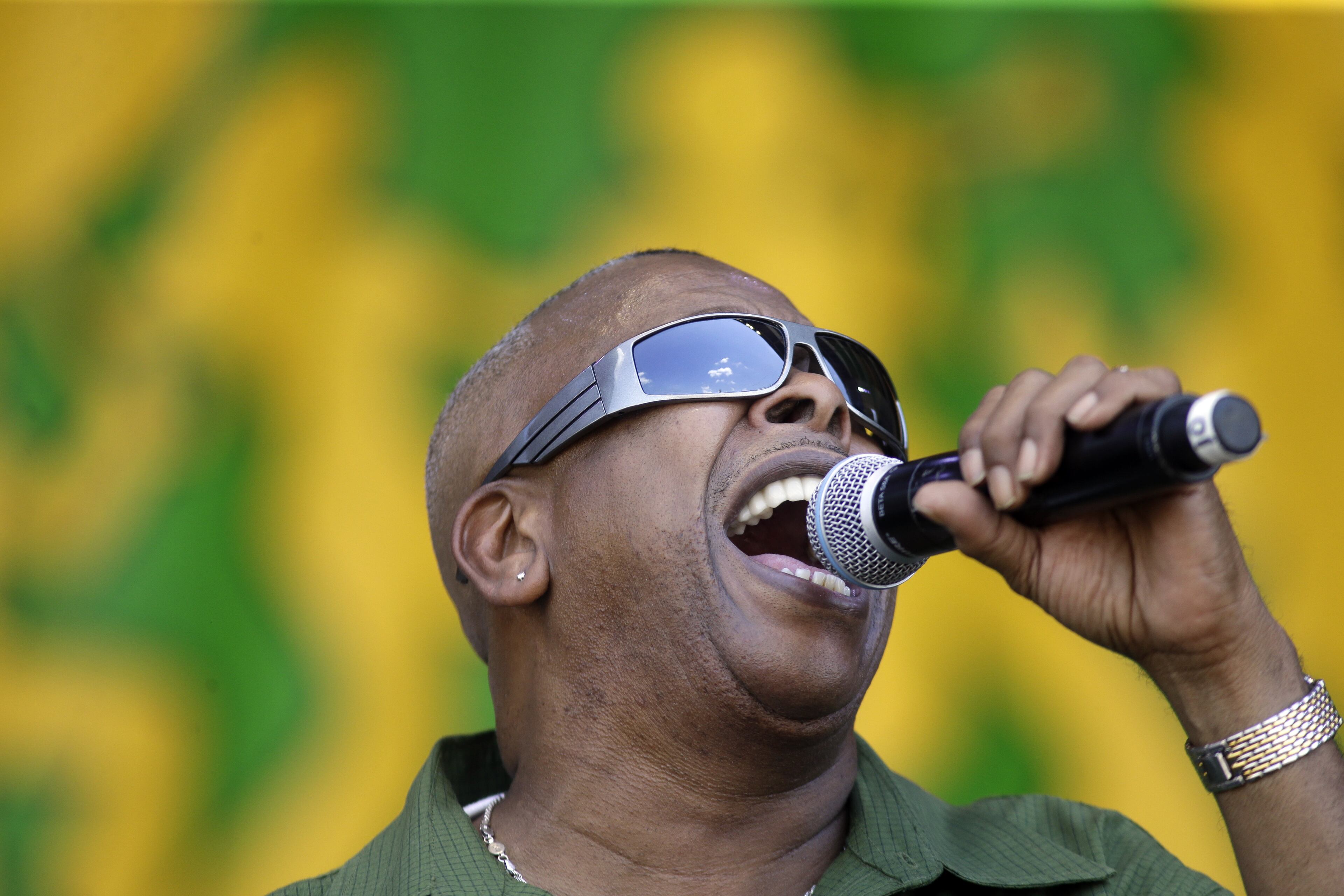 Brother Tyrone performs with his band Brother Tyrone & the Mindbenders at the New Orleans Jazz and Heritage Festival in New Orleans, Sunday, May 3, 2015. (AP Photo/Gerald Herbert)