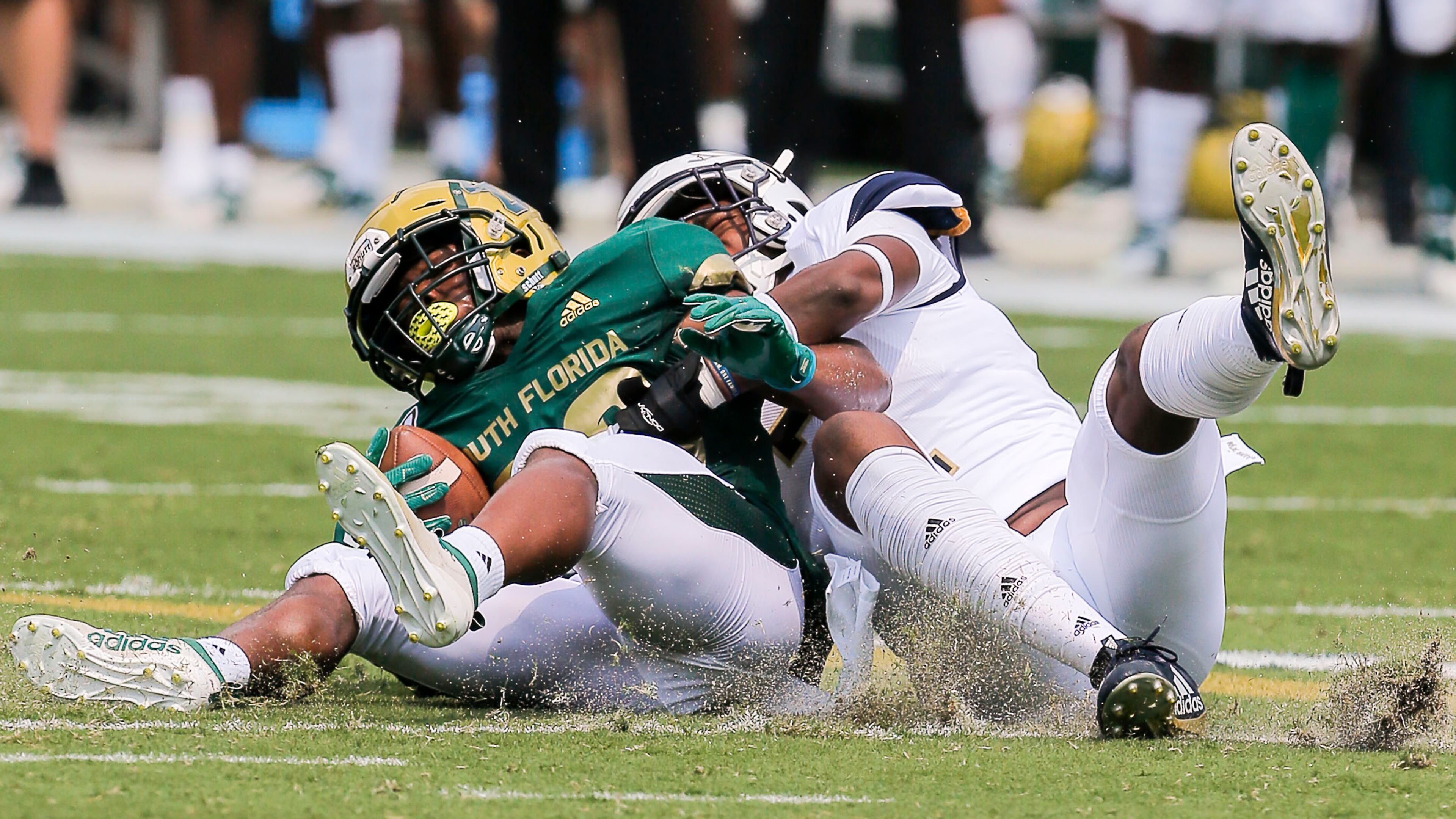 Georgia Tech Yellow Jackets defensive back Tariq Carpenter (2) tackles South Florida Bulls running back Johnny Ford (20). (Alyssa Pointer/alyssa.pointer@ajc.com)