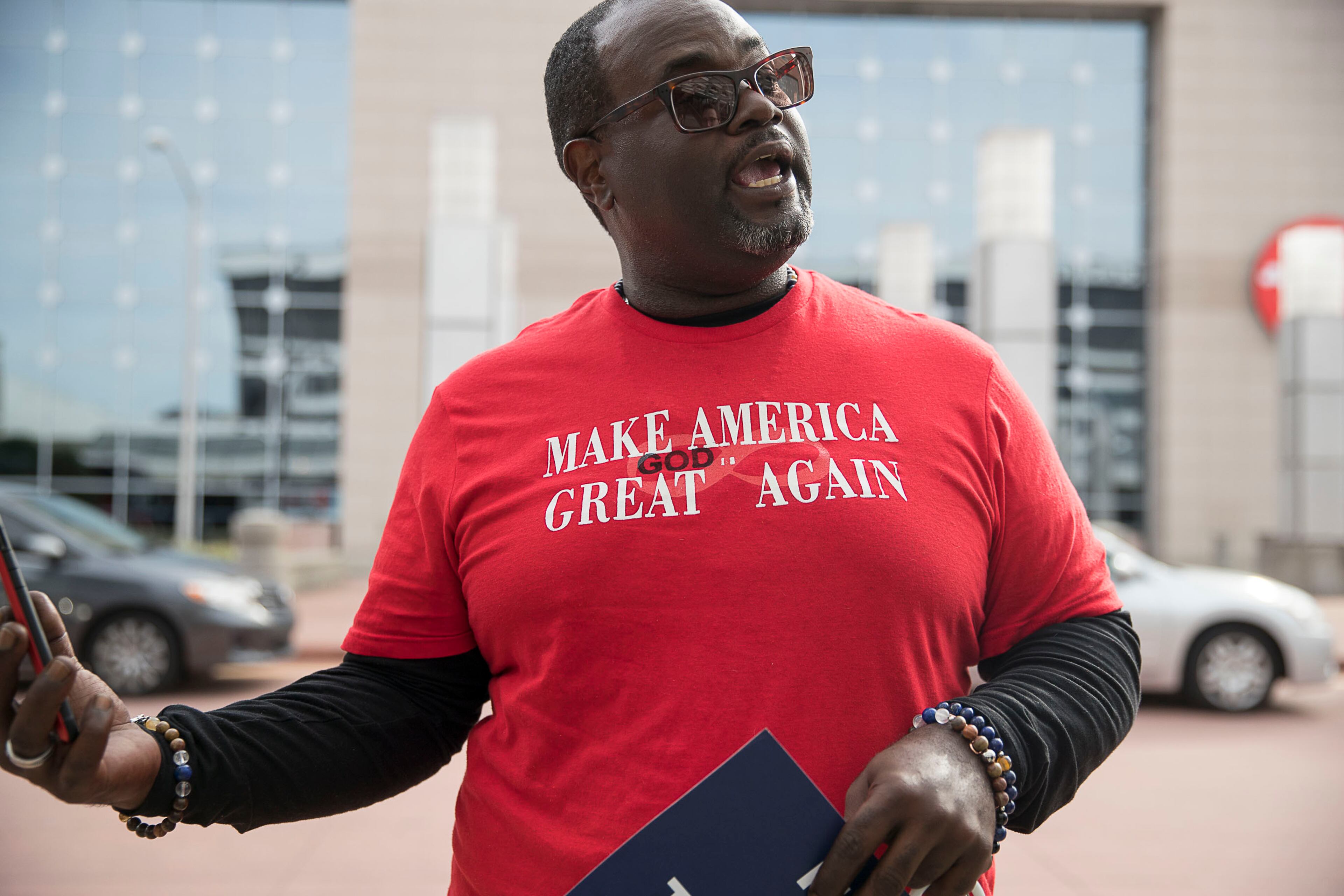 11/08/2019 -- Atlanta, Georgia -- Pertis Williams, founder of Uniting America Project "Hue"manity, talks about why he supports Mirianne Williamson and President Donald Trump outside of the Georgia World Congress Center in downtown Atlanta, Friday, November 8, 2019. (Alyssa Pointer/Atlanta Journal Constitution)