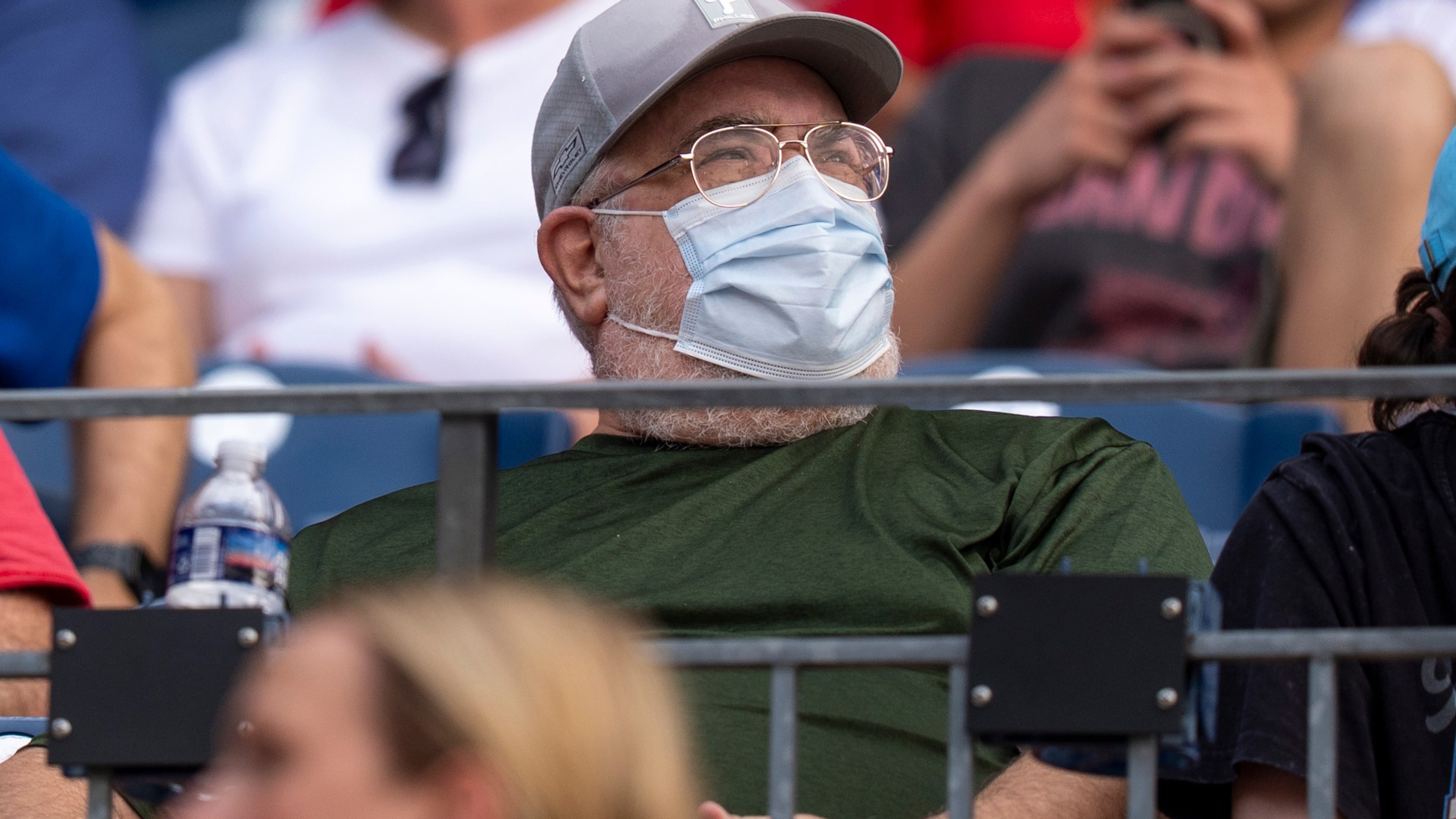 A fan wears a mask during an air quality warning from wildfire smoke prior to baseball game between the New York Mets and the Philadelphia Phillies, Thursday, July 16, 2026, in Philadelphia. (AP Photo/Chris Szagola)