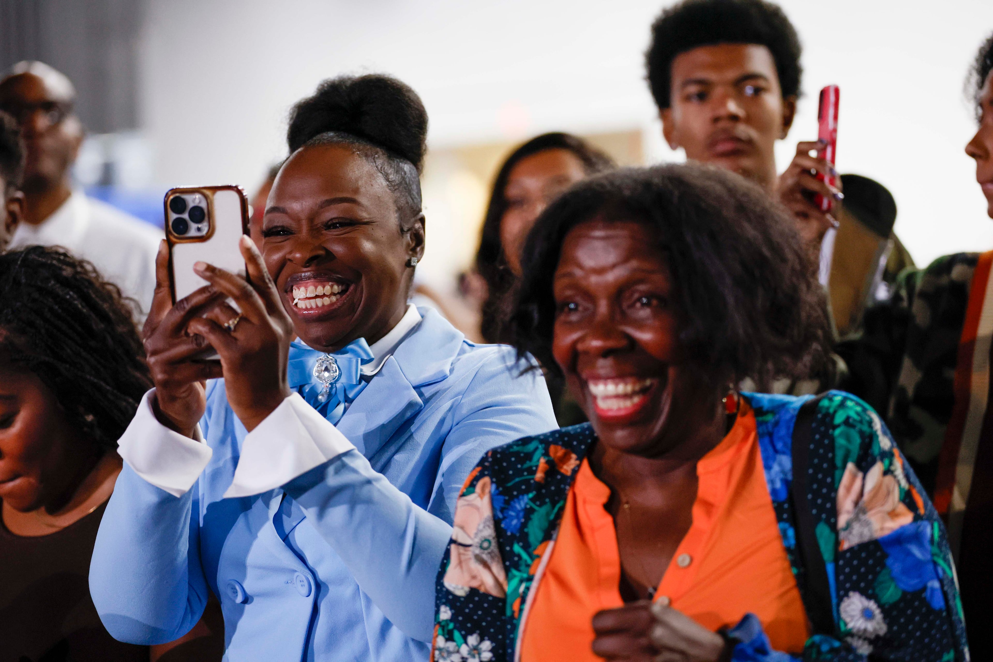 Friends and family cheer for their graduates during the Spelman College Commencement ceremony at the Georgia International Convention Center in College Park on Sunday, May 17, 2026. (Miguel Martinez/AJC)