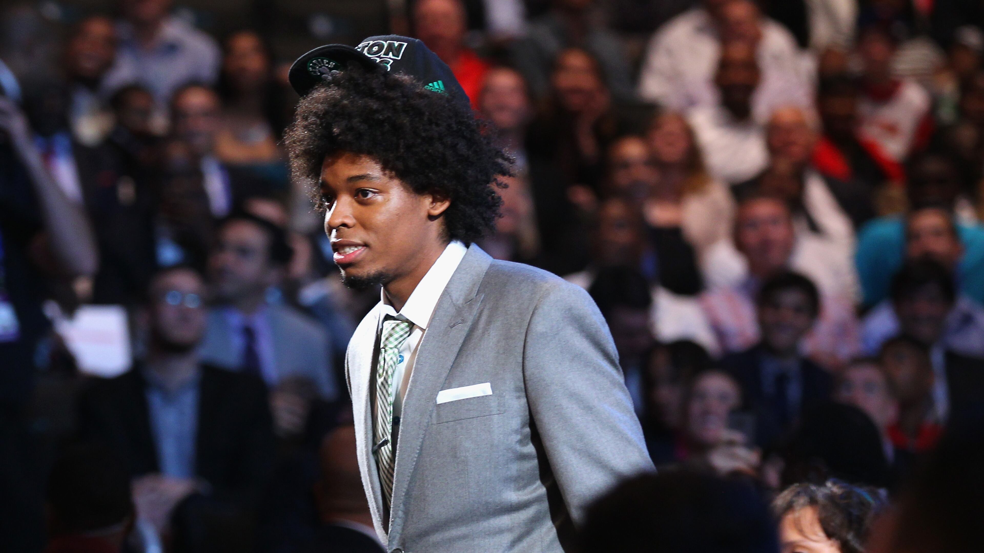 Lucas Bebe Nogueira (R) of Brazil walks through the green room towards the stage after he was drafted #16 overall in the first round by the Boston Celtics during the 2013 NBA Draft at Barclays Center on June 27, 2013 in in the Brooklyn Bourough of New York City.