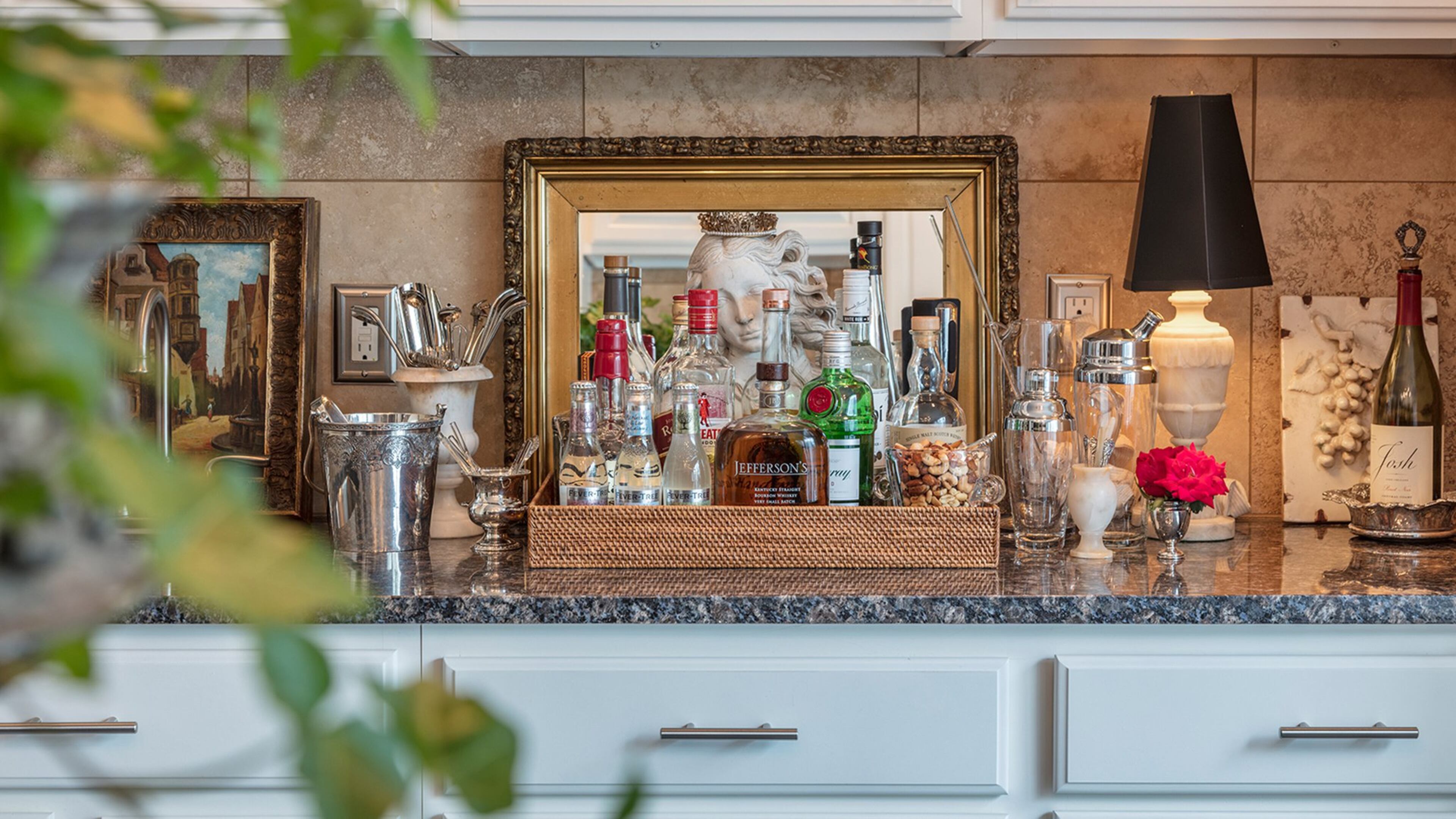 A beautifully styled bar is always at the ready in the kitchen, so guests can help themselves. (Bob Greenspan/TNS)