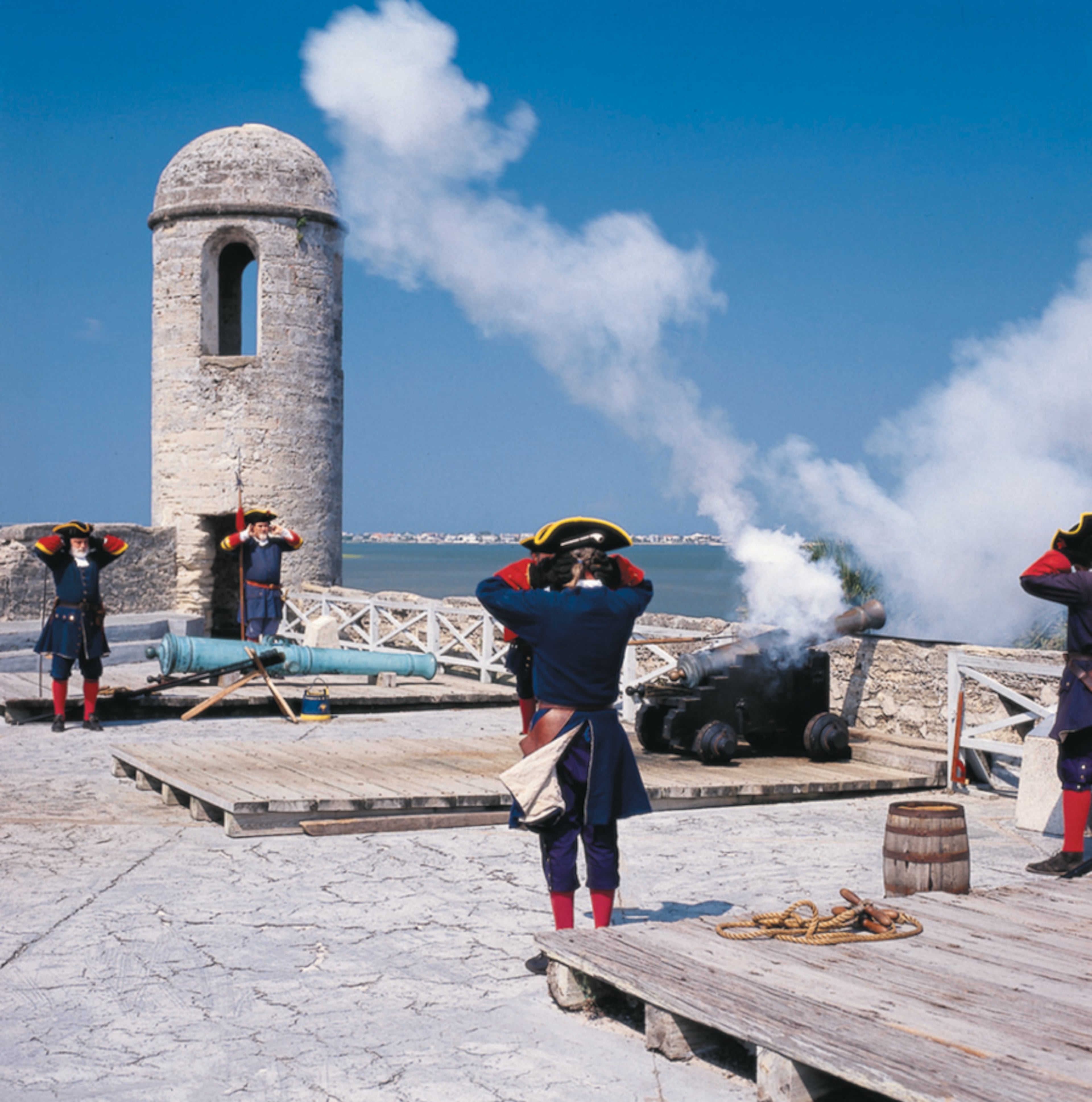Reenactors in colonial-era Spanish military uniforms execute a cannon firing drill at the Castillo de San Marcos National Monument in historic St. Augustine. (Courtesy of Florida's Historic Coast)
