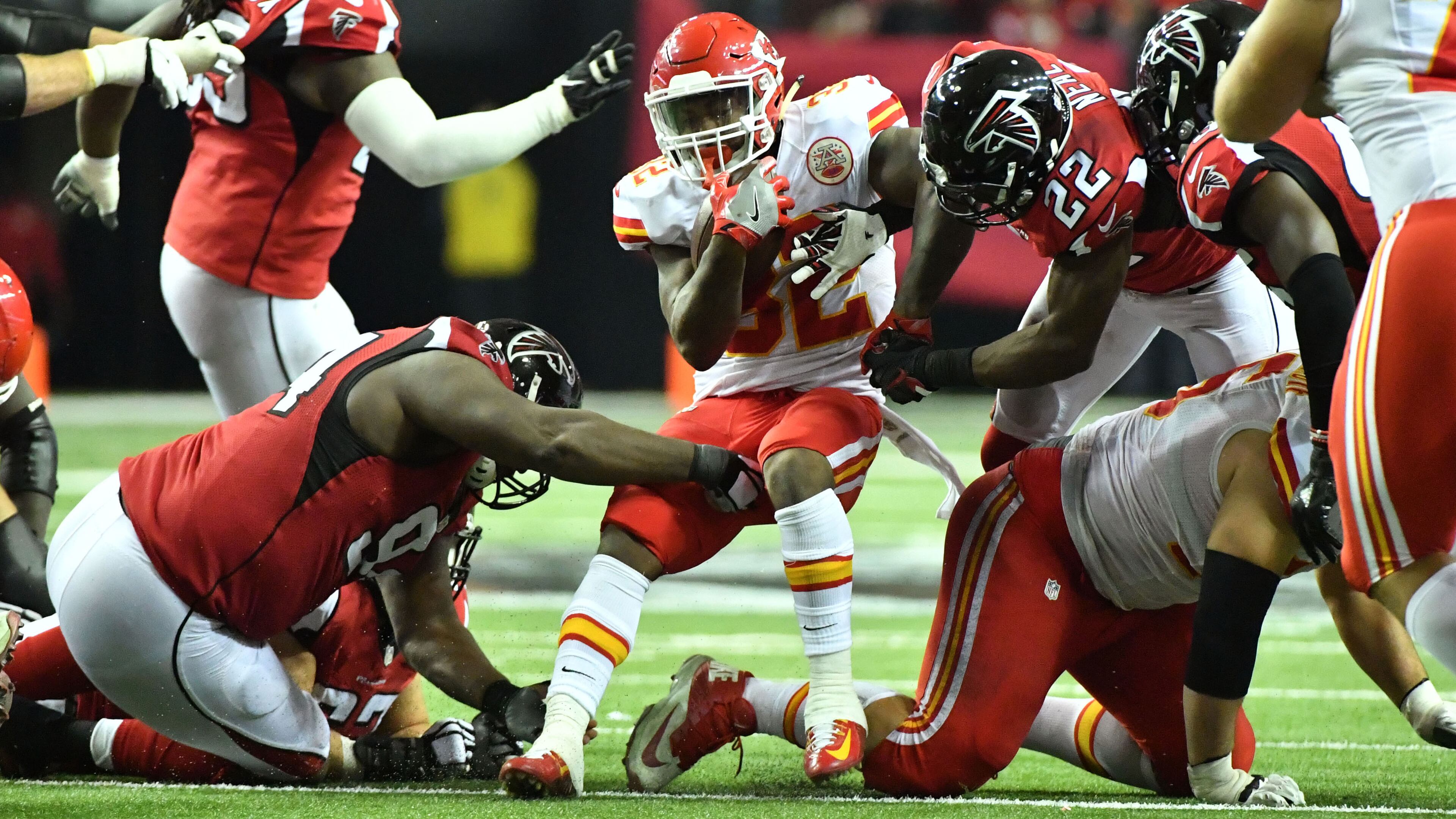 December 4, 2016 Atlanta - Kansas City Chiefs running back Spencer Ware (32) gets tackled by Atlanta Falcons defensive end Tyson Jackson (left) and Atlanta Falcons strong safety Keanu Neal (22) during the second half in an NFL football game at the Georgia Dome on Sunday, December 4, 2016. Kansas City Chiefs won 29 - 28 over the Atlanta Falcons. HYOSUB SHIN / HSHIN@AJC.COM