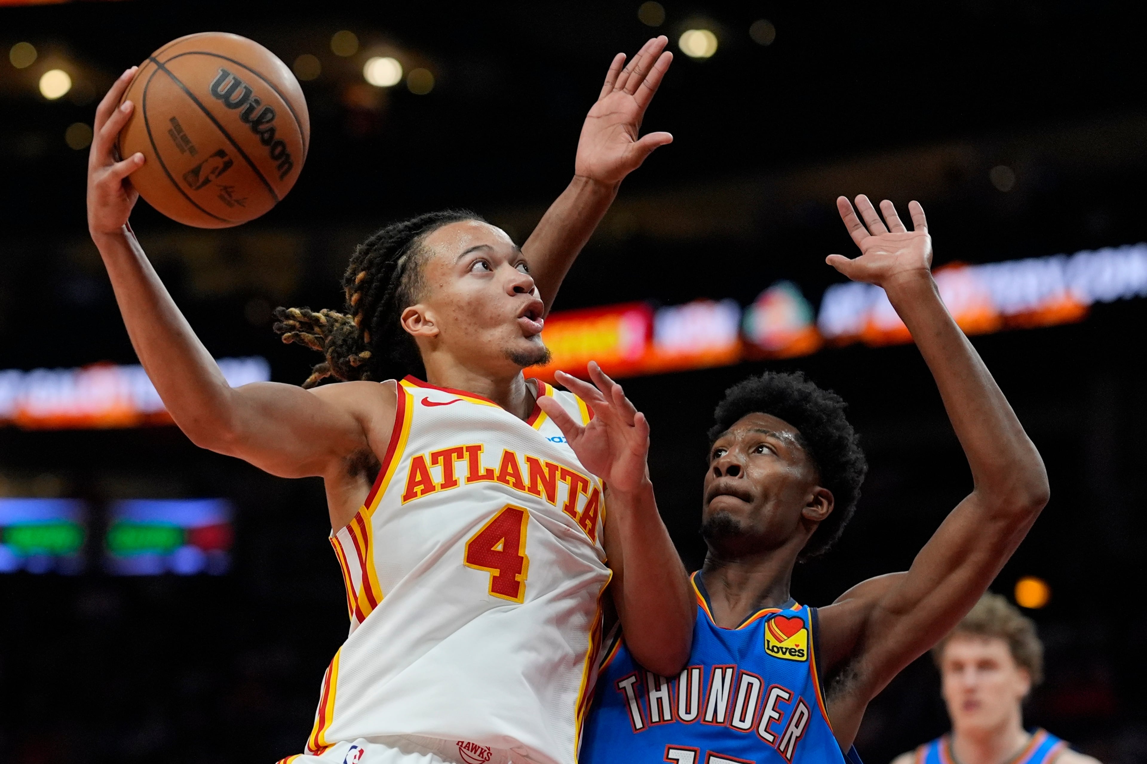 Atlanta Hawks guard Kingston Flemings shoots against Oklahoma City Thunder forward Andrew Holifield during the second half of an NBA preseason basketball game, Monday, Oct. 12, 2026, in Atlanta. (Mike Stewart/AP)