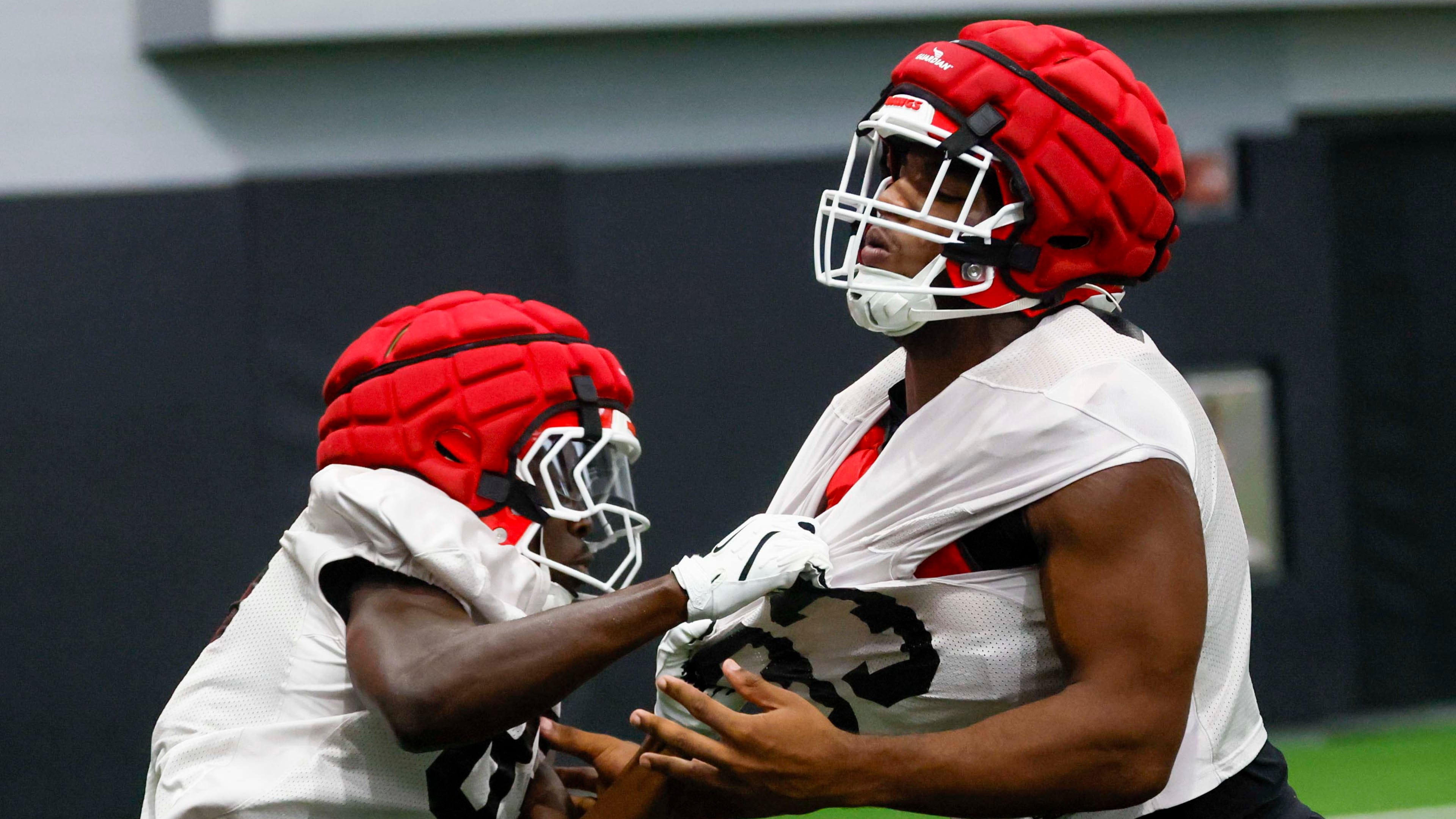 Georgia linebacker PJ Dean (right) is pulled out during their first football practice at the University of Georgia practice facility, Wednesday, August 5, 2026, in Athens, Ga. (Miguel Martinez/AJC)
