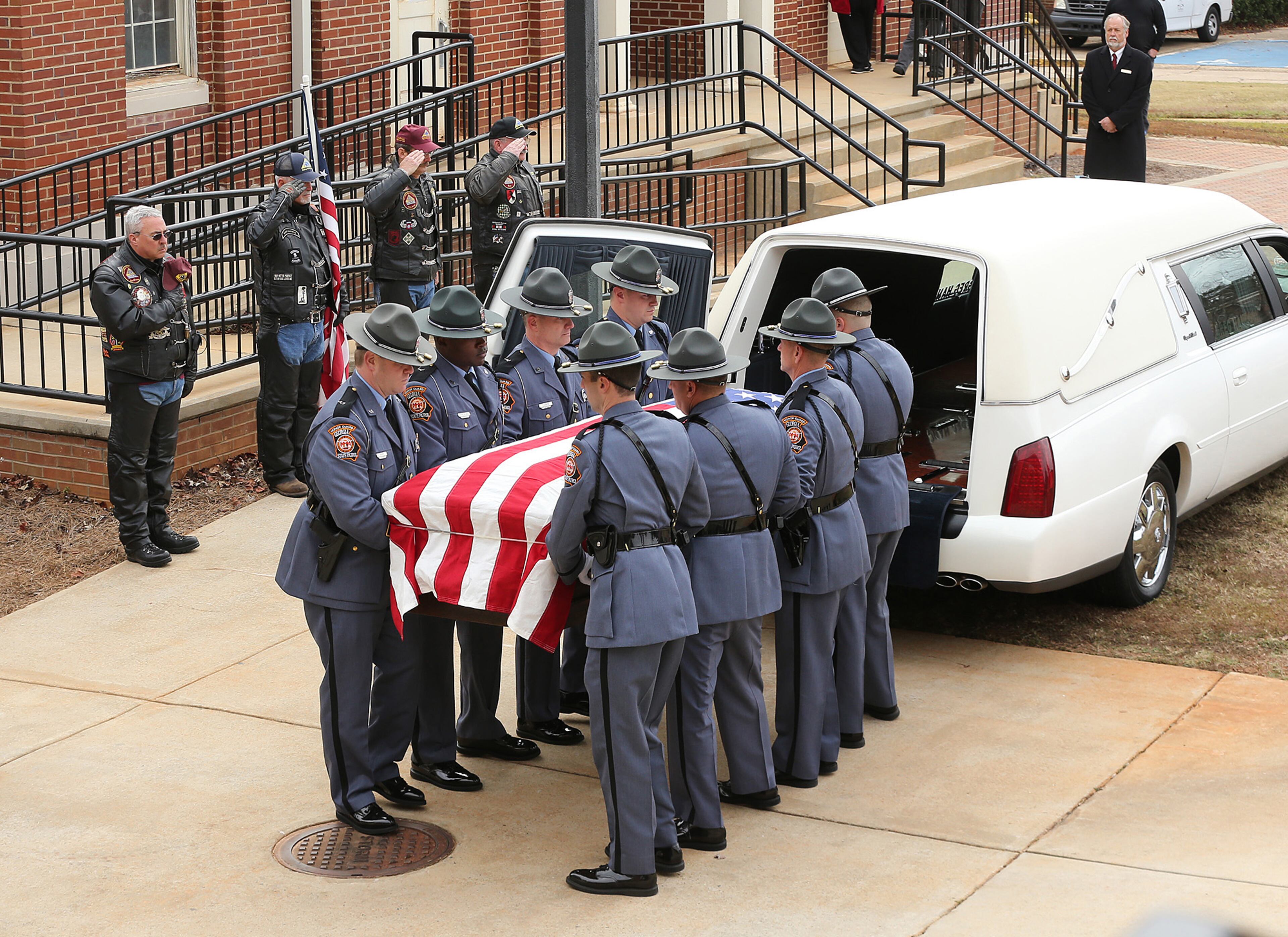 December 11, 2016, AMERICAS: Americus police officer Nicholas Ryan Smarr arrives by honor guard to his funeral service at the Georgia Southwestern State University Storm Dome on Sunday, Dec. 11, 2016, in Americas. Officer Smarr and Georgia Southwestern State University campus police officer Jody Smith were killed responding to a domestic dispute. Curtis Compton/ccompton@ajc.com