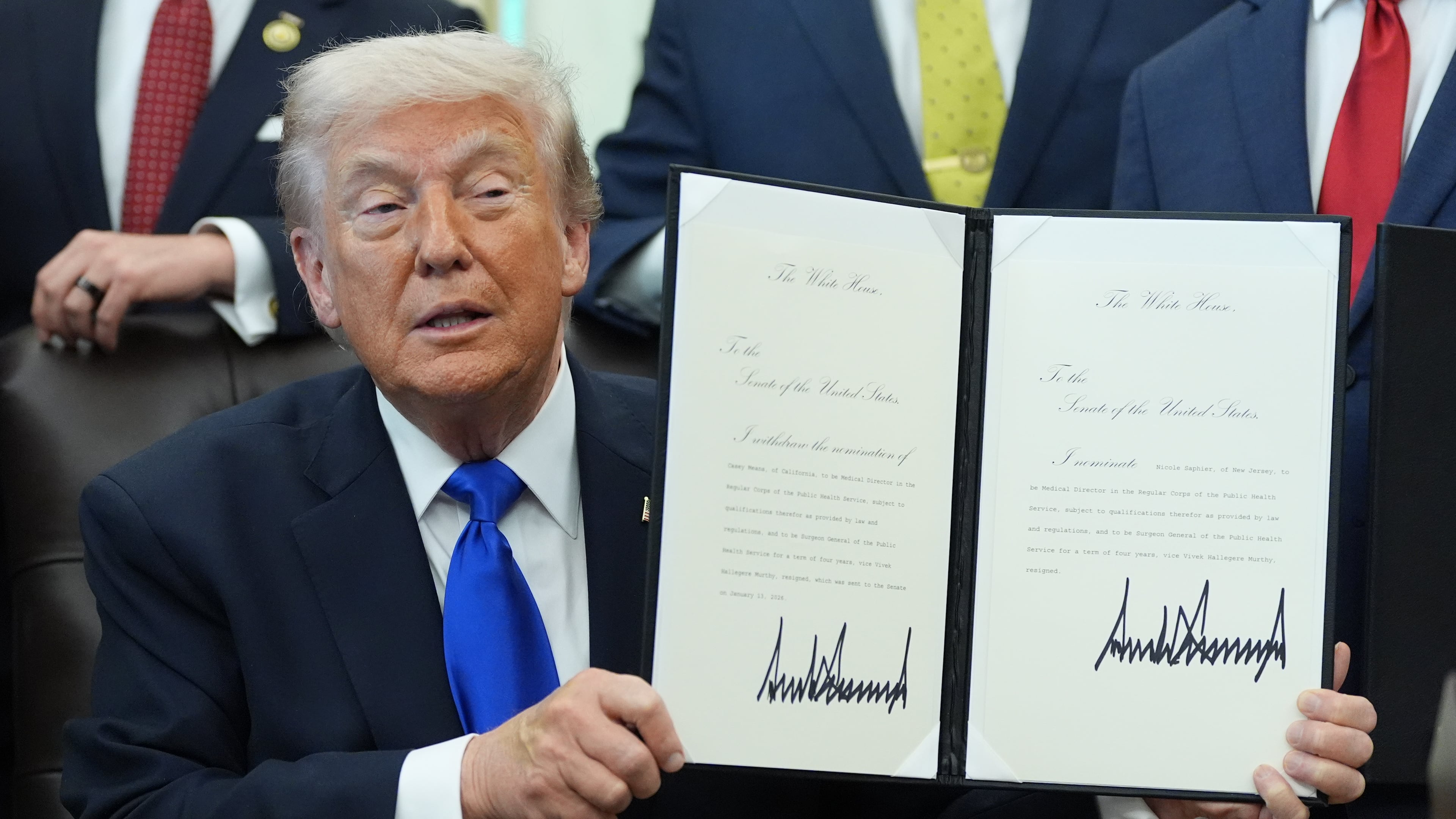 President Donald Trump signs documents regarding the withdrawal of the current nomination and nomination of a new surgeon general in the Oval Office of the White House, Thursday, April 30, 2026, in Washington. (AP Photo/Alex Brandon)