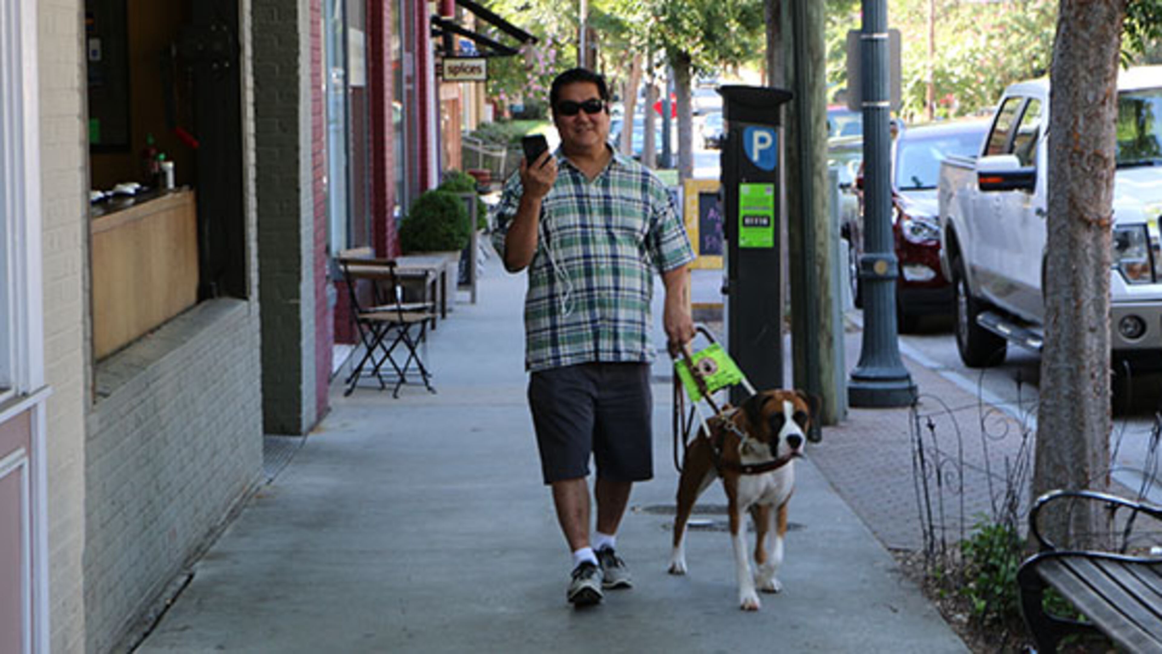 Foresight Augmented Reality co-founder, David Furukawa, demonstates his company’s app that, when paired with its Bluetooth beacon, can guide visually impaired people to, among other things, specific rooms, restrooms and elevators, along with descriptive information of entrances, exits, and hazard warnings. Sixty-five beacons have been recently installed throughout Decatur’s downtown. Courtesy of Foresight Augmented Reality