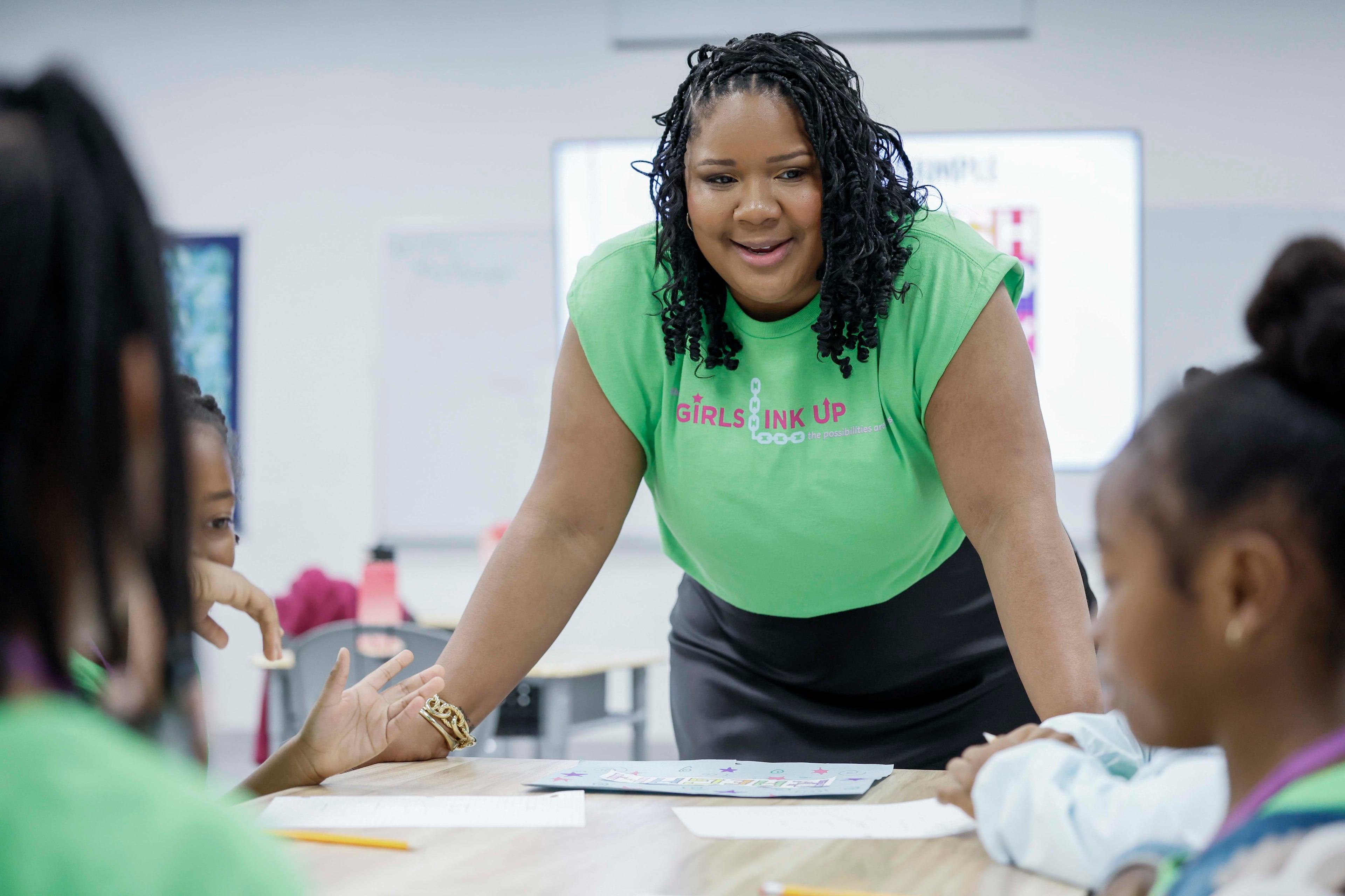 Raioni Madison interacts with a third grade group as they work during the first day of the 3D Girls summer camp at Ethos Classical Middle School on Monday, June 1, 2026. (Miguel Martinez/AJC)