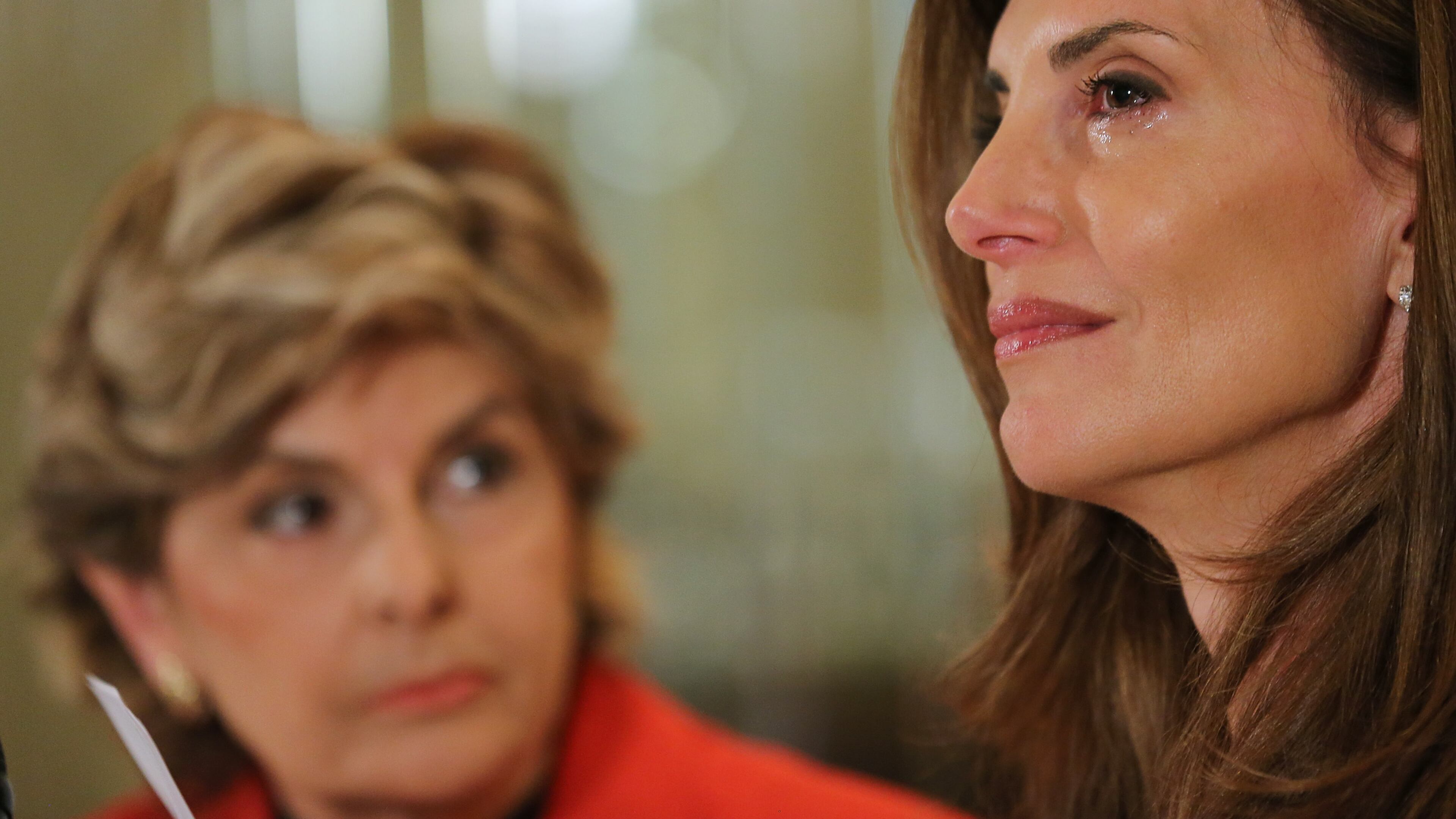 NEW YORK, NY - OCTOBER 20: Karena Virginia (R) speaks at a press conference where she identifies herself as victim of sexual misconduct by Republican Presidential Candidate Donald Trump at a press conference at The London Hotel on October 20, 2016 in New York City. Karena Virginia states that she was a victim of inappropriate contact during an encounter with Donald Trump at the 1998 U.S. Open Tennis Tournament in the Flushing neighborhood of the Queens borough of New York City. (Photo by Jemal Countess/Getty Images)