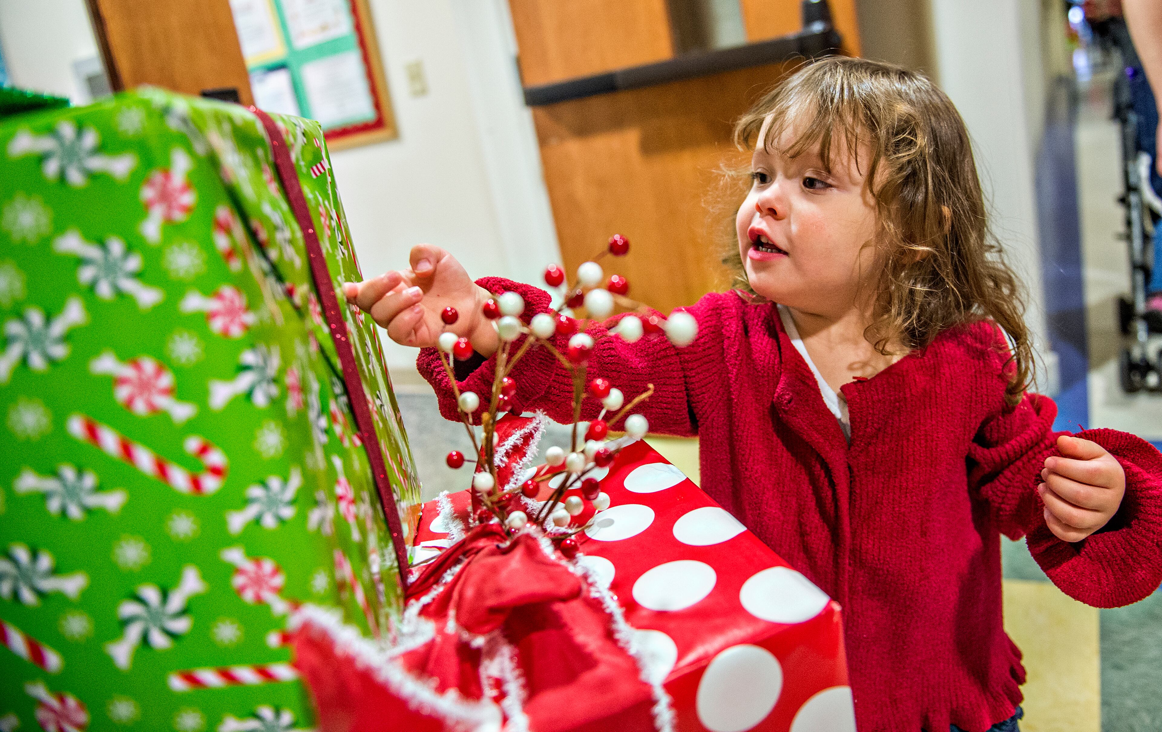 November 14, 2015 Dunwoody - Finley Maddox investigates wrapped boxes during the Dunwoody United Methodist Church Holiday Festival on Saturday, November 14, 2015. The 24th annual festival brought artists and crafters together to sell holiday themed items. JONATHAN PHILLIPS / SPECIAL
