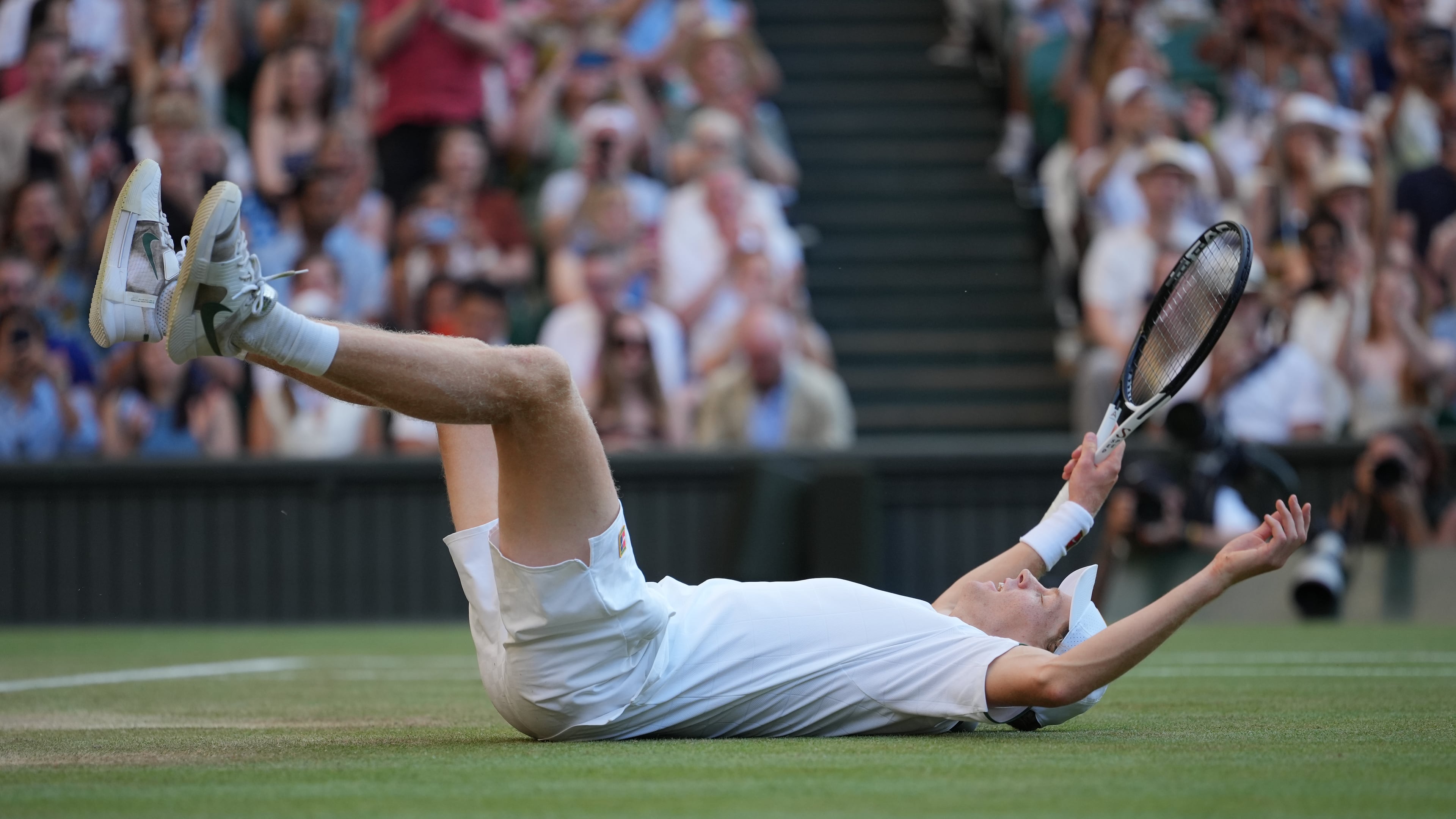 Jannik Sinner of Italy celebrates after winning a point against Alexander Zverev of Germany men's singles final at Wimbledon Tennis Championships in London, Sunday, July 12, 2026. (AP Photo/Kin Cheung)