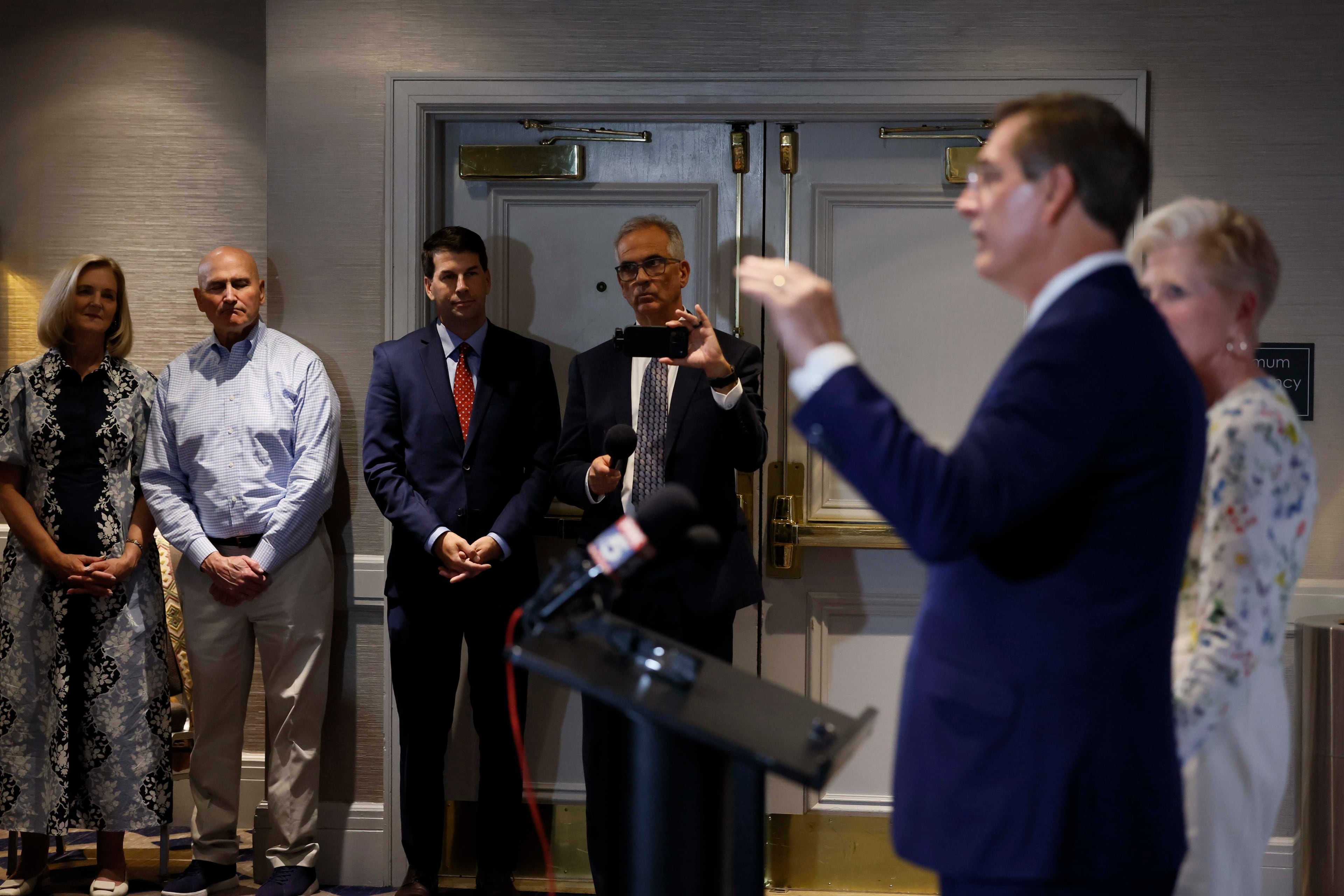 Supporters of Secretary of State Brad Raffensperger watch his speech during the primary election night watch party at the Waverly Hotel on Tuesday. (Miguel Martinez/AJC)
