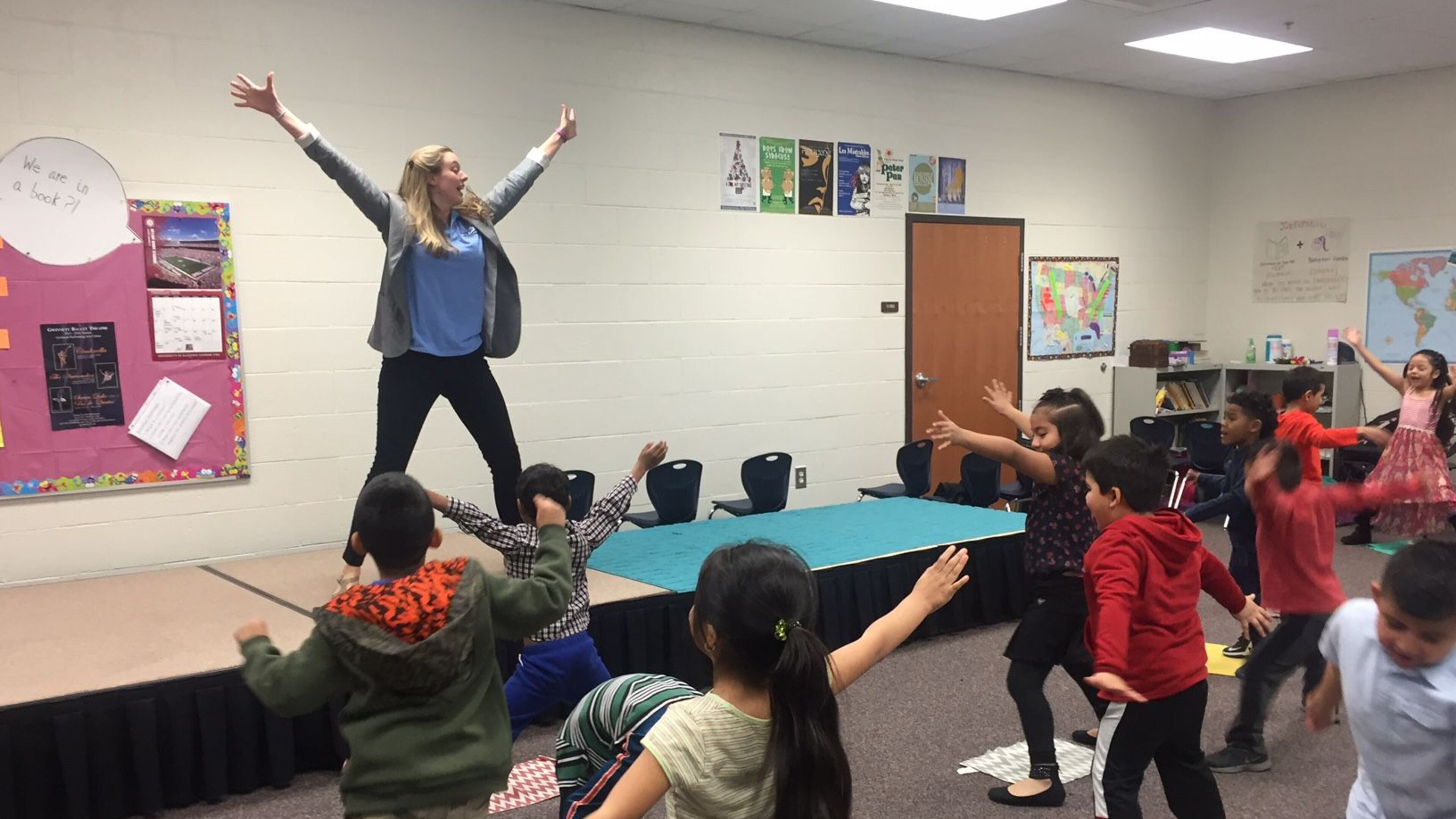Graves Elementary School teacher Sarah Jones leads a kindergarten class in a dance exercise before acting out “The Tortoise and The Hare.” “When we move our body, we do good things for our brain,” she told the students. ERIC STIRGUS/STAFF.