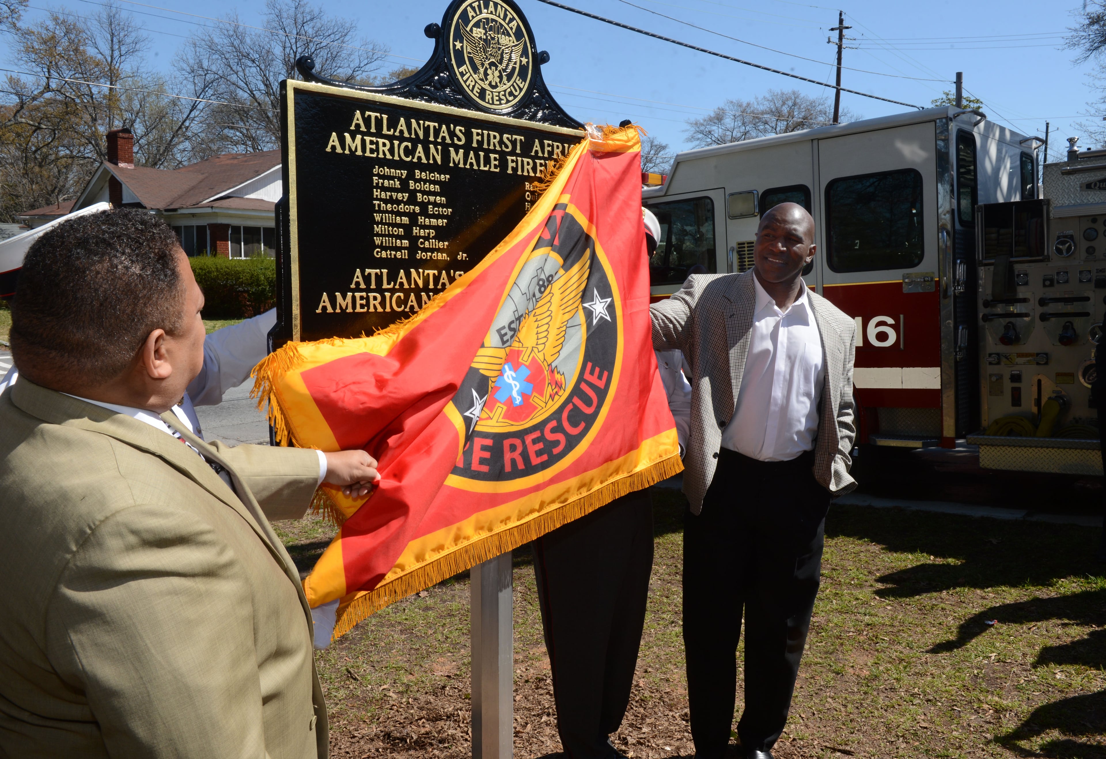 Atlanta City Councilman Michael Julian Bond (LEFT) and boxing great Evander Holyfield unveil a marker at Atlanta Fire Rescue Station 16 honoring the Black men and women that broke the color and gender barrier following the ceremony Monday. The City of Atlanta honored 16 Black firefighters that broke the color barrier and integrated the Atlanta Fire Department 50 years ago, Monday April 1 2013. Retired Chief William Hamer remembers arriving at a fire to find a crowd of black resident cheering him on."They were so proud of us, " recalled Hamer, one of the first African Americans in modern times to join the Atlanta Fire Department. But it was all cheers. Hamer recalls the chilly reception he received from some of his white colleagues.On Monday, 50 years, after 16 men became the first African American firefighters in Atlanta, the city will honor Hamer and others. He said about 8 are still living. The city will also honor a few of the first black women firefighters.