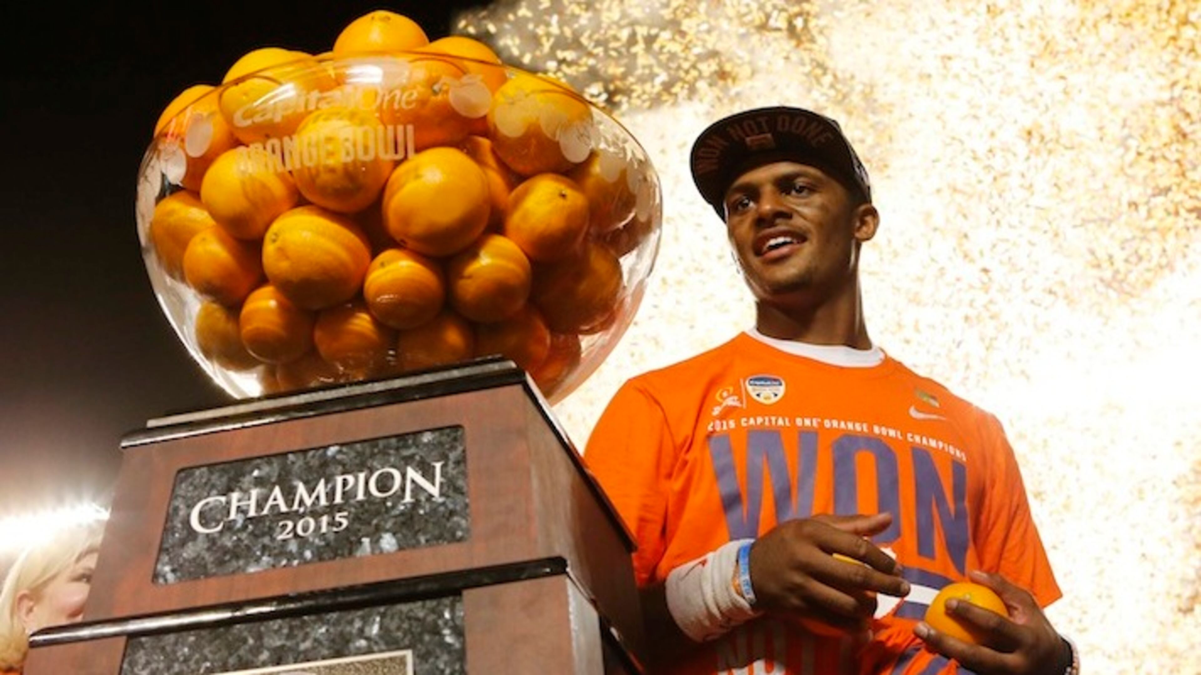 Clemson quarterback Deshaun Watson (4) poses with the Orange Bowl trophy following an NCAA college football semifinal playoff game against Oklahoma, Thursday, Dec. 31, 2015, in Miami Gardens, Fla. Clemson defeated Oklahoma 37-17. (AP Photo/Joe Skipper)