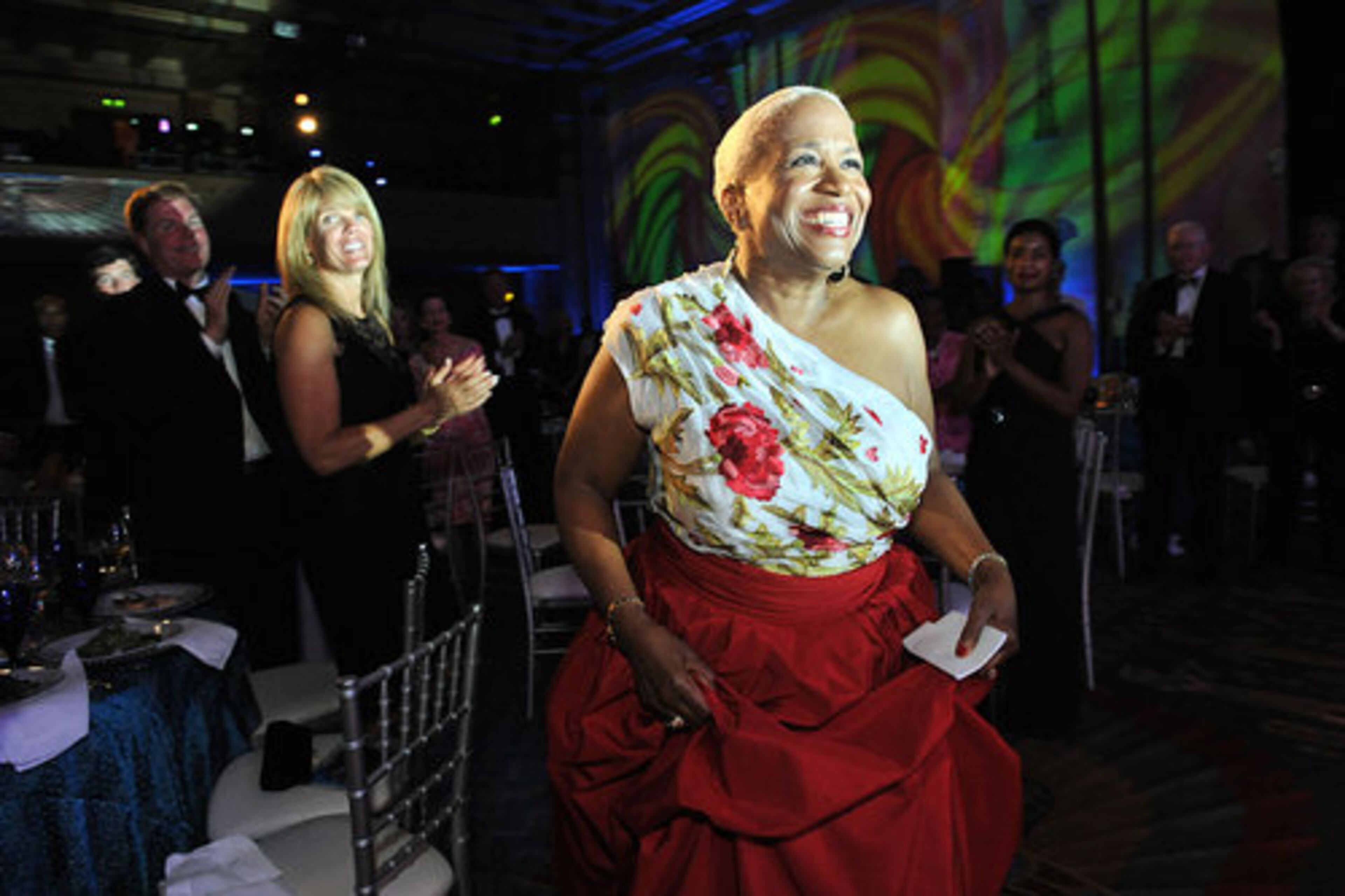 Monica Pearson walks to the stage for her final speech during the event.