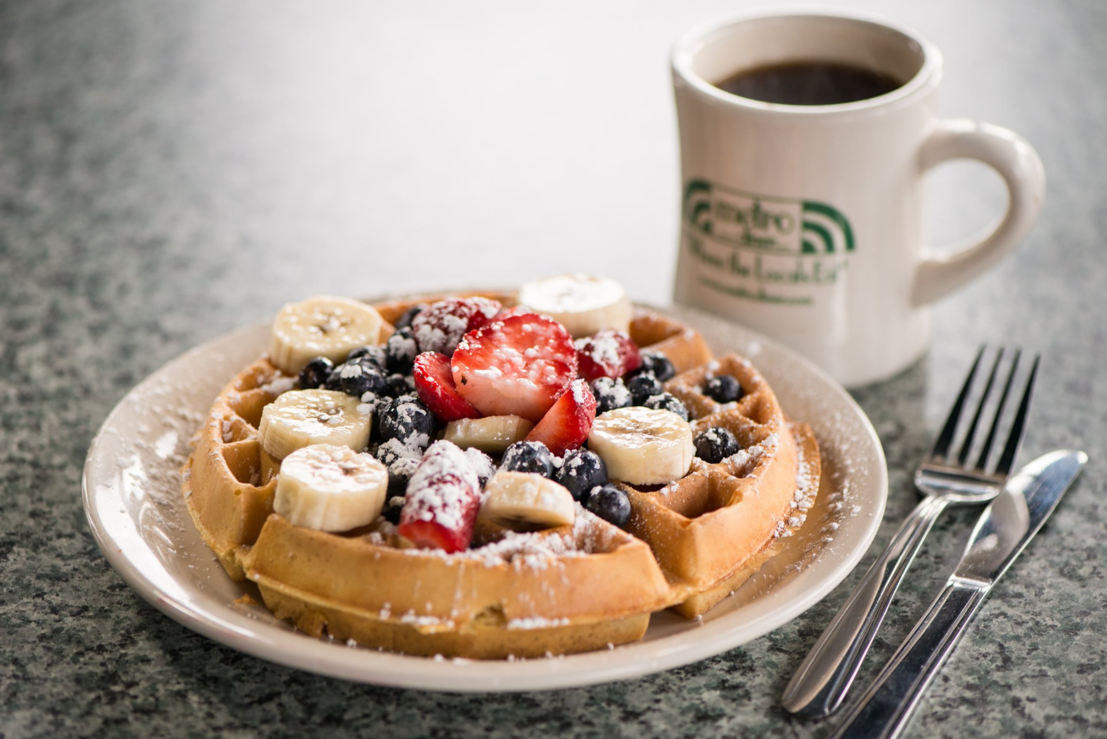Fruity Waffle with blueberries, strawberries, bananas, and powdered sugar. Photo credit: Mia Yakel.