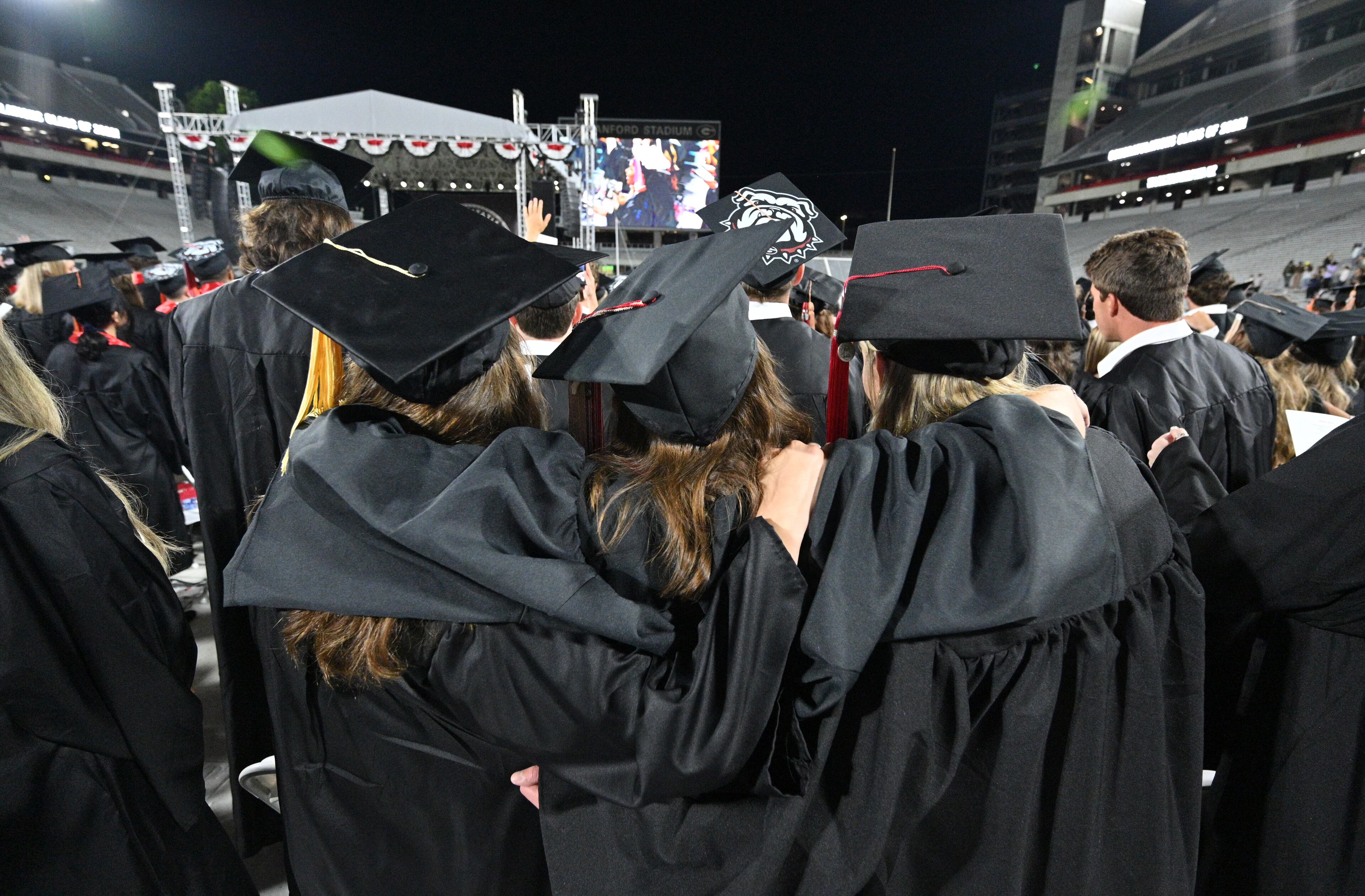 UGA graduates sing the alma mater during the 2022 Spring Undergraduate Commencement at Sanford Stadium in Athens on on Friday, May 13, 2022. (Hyosub Shin / Hyosub.Shin@ajc.com)