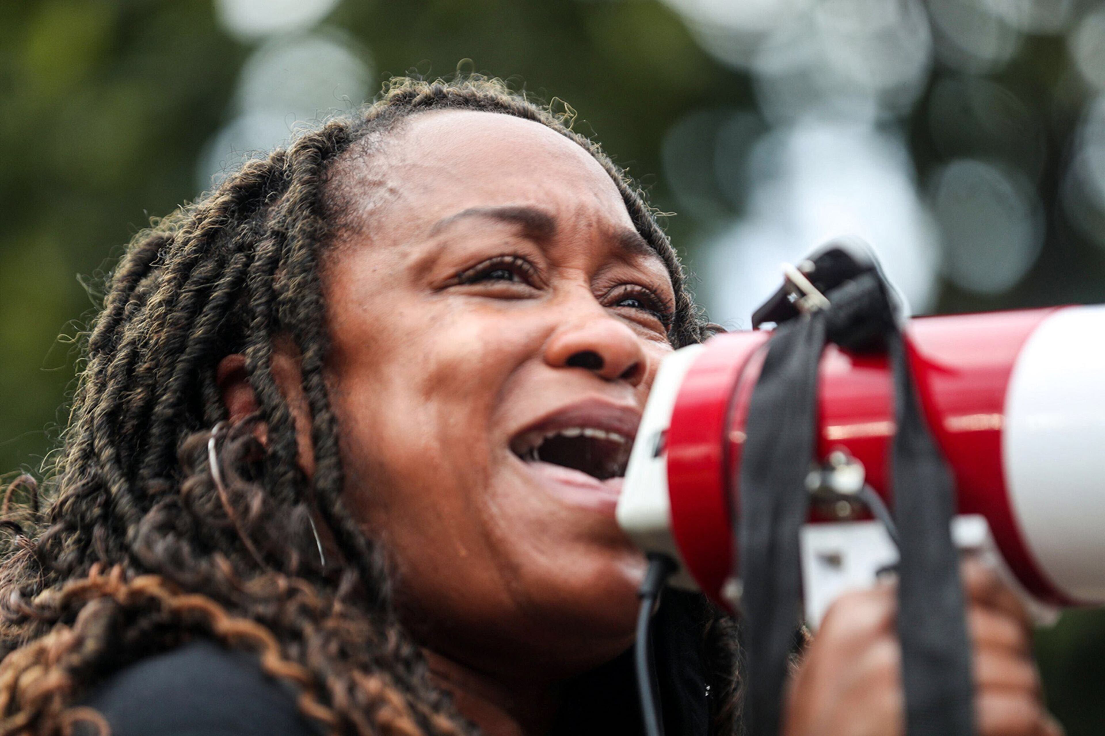 Gia Johnson of Forsyth County becomes emotional when speaking about Breonna Taylor during a rally at Cleopas Park. Johnson said she is tired and angry with the outcome of the police officers involved in the killing of Breonna Taylor. Protesters gather Wednesday, Sept. 23, 2020, in Atlanta after one of three officers involved in the death of Breonna Taylor was charged. However, his charges were not directly related to the killing of Taylor. (Alyssa Pointer / Alyssa.Pointer@ajc.com)