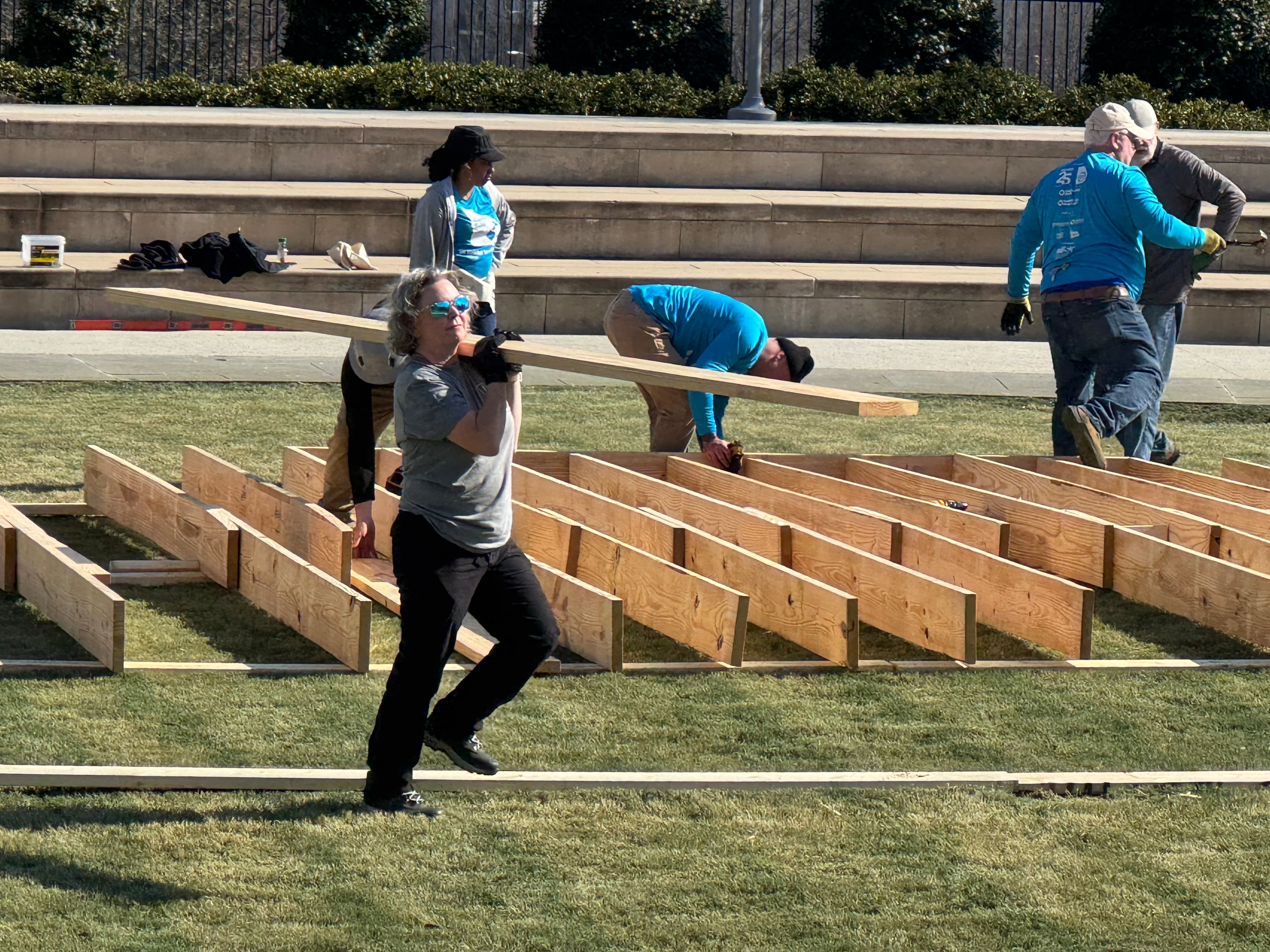Workers help construct a Habitat for Humanity home on Liberty Plaza in Atlanta on Tuesday. (Adam Beam/AJC)