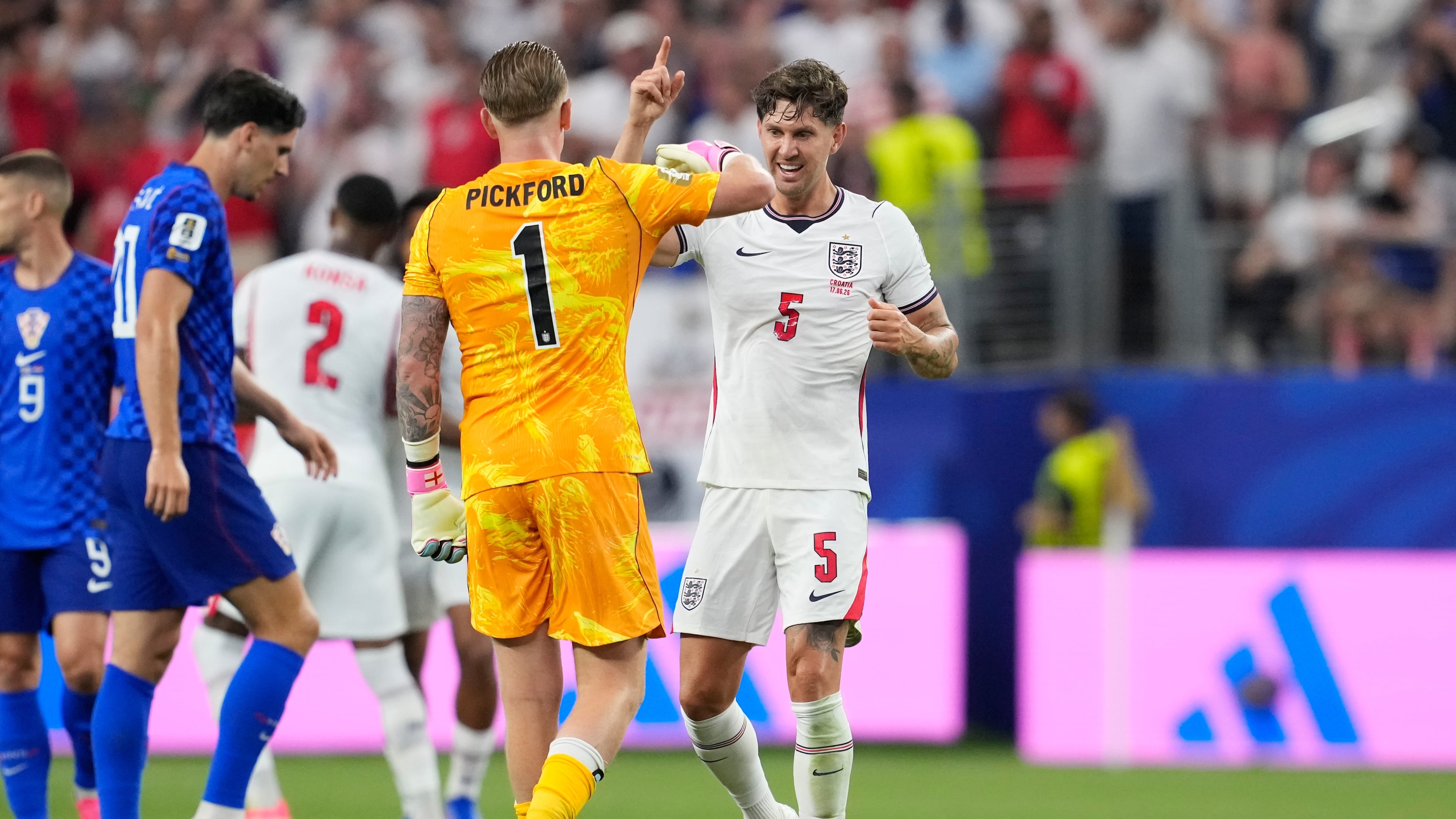 England's John Stones (5) and England goalkeeper Jordan Pickford (1) celebrate their team's fourth goal by England's Marcus Rashford during the World Cup Group L soccer match between England and Croatia in Arlington, Texas, near Dallas, Wednesday, June 17, 2026. (AP Photo/Tony Gutierrez)