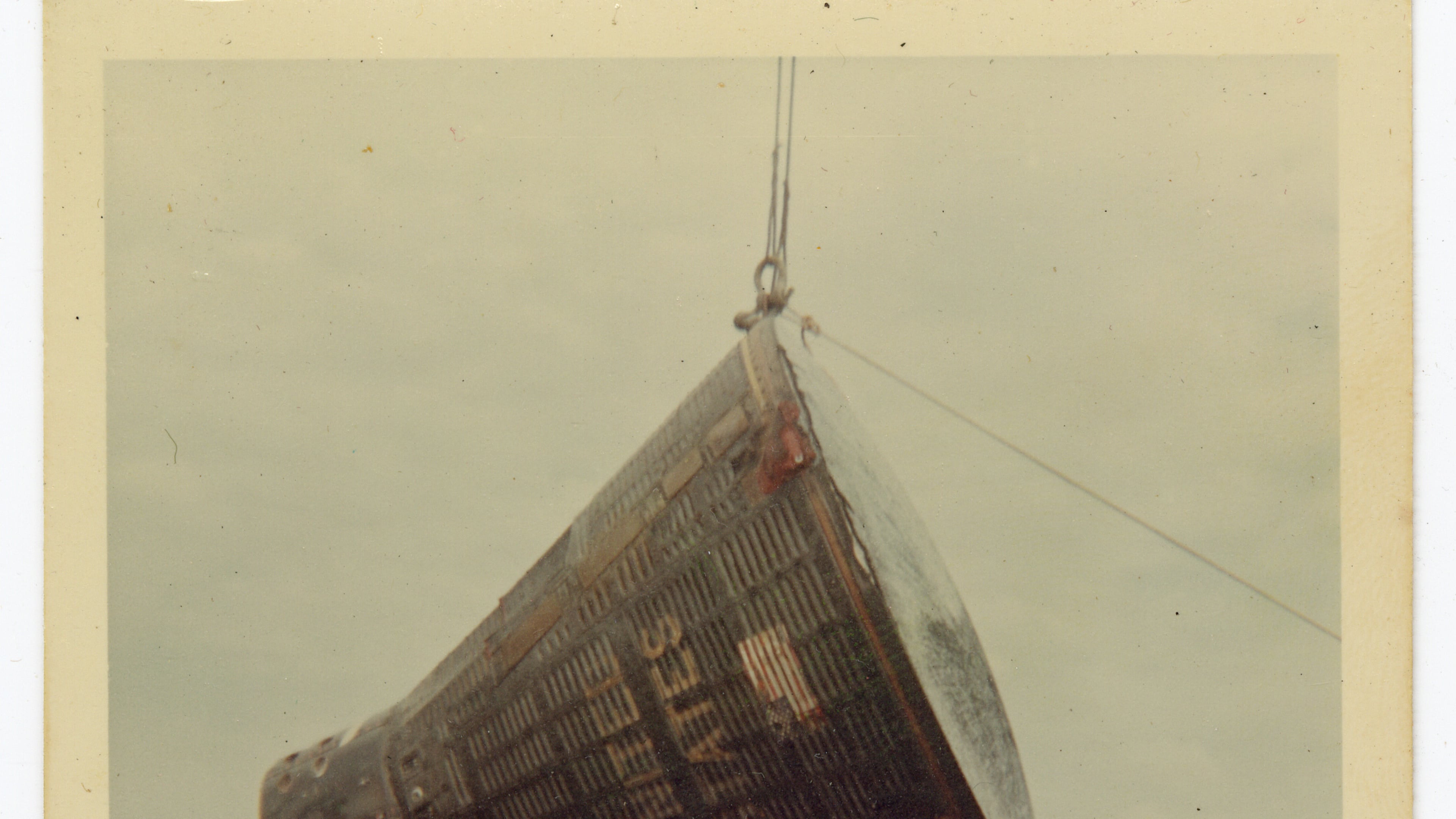 This 1966 image taken by Ron McQueeney shows the Gemini 8 spacecraft being lifted for transport at Naha Air Base in Okinawa, Japan. (Ron McQueeney/Ohio History Connection via AP)