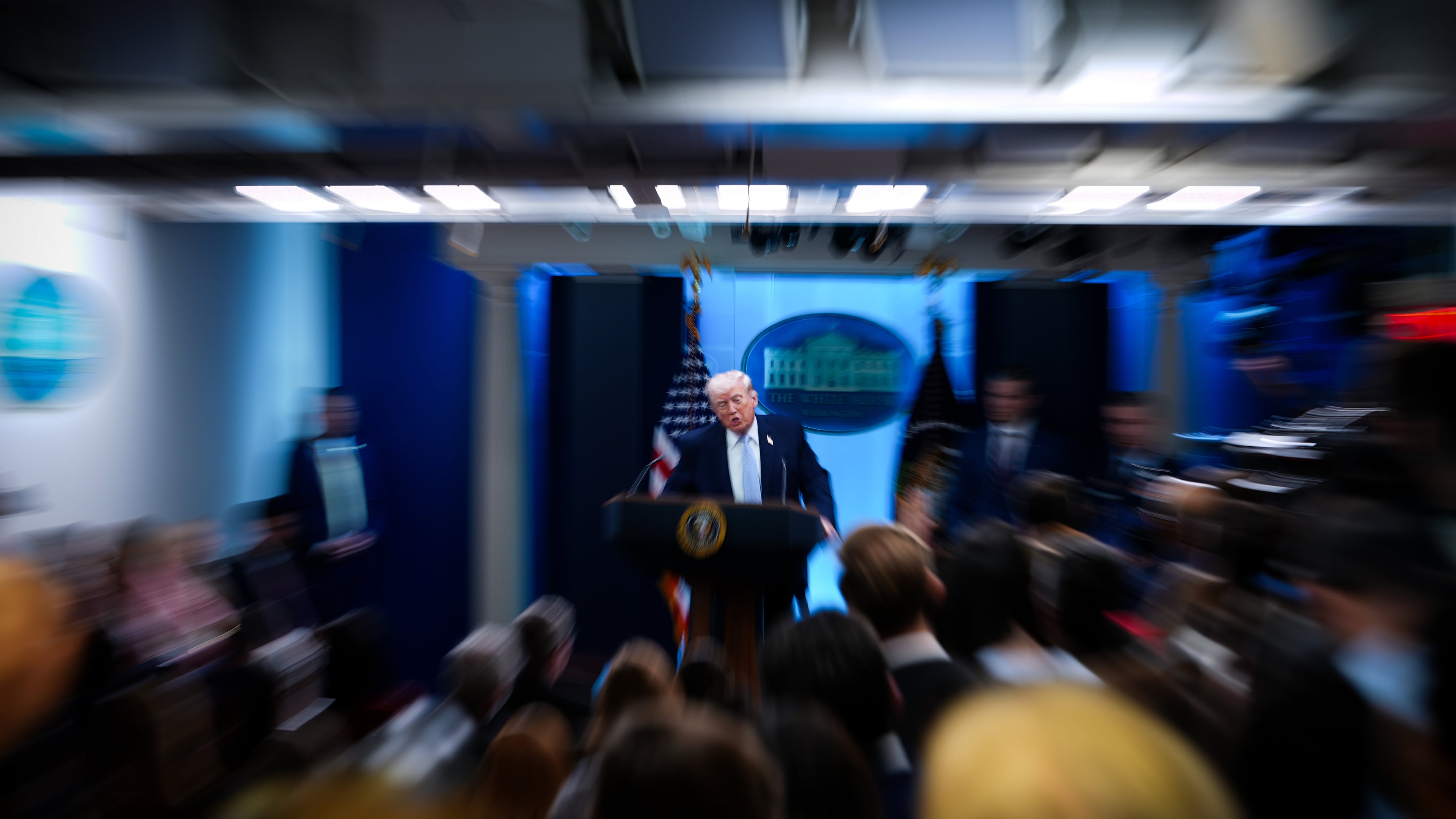 President Donald Trump, accompanied by Defense Secretary Pete Hegseth and Chairman of the Joint Chiefs of Staff Gen. Dan Caine, speaks with reporters in the James Brady Press Briefing Room at the White House, Monday, April 6, 2026, in Washington. (AP Photo/Julia Demaree Nikhinson)