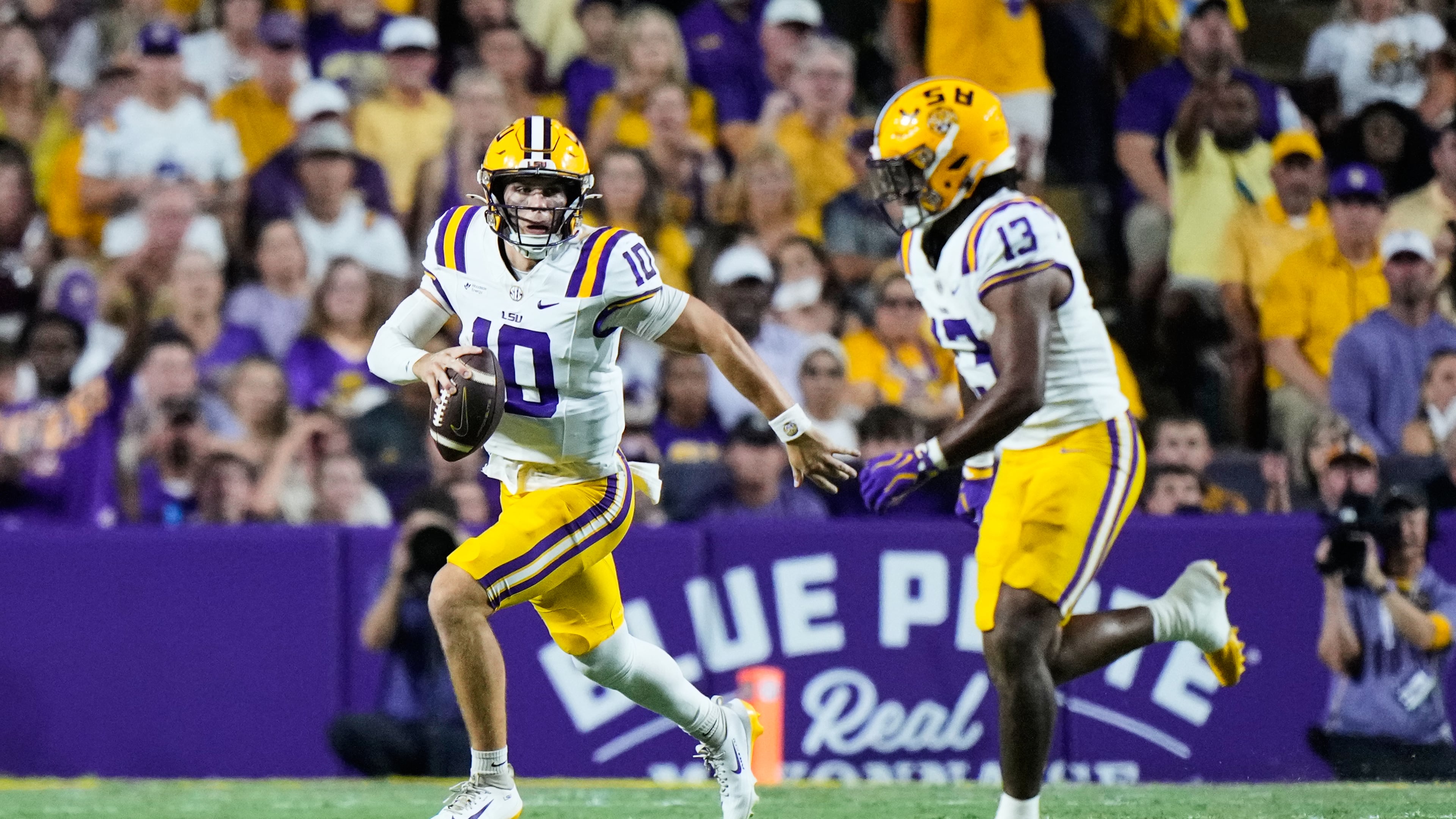 LSU quarterback Sam Leavitt (10) carries against Texas A&M in the first half of an NCAA college football game against LSU, Saturday, Sept. 26, 2026 in Baton Rouge, La. (AP Photo/Gerald Herbert)