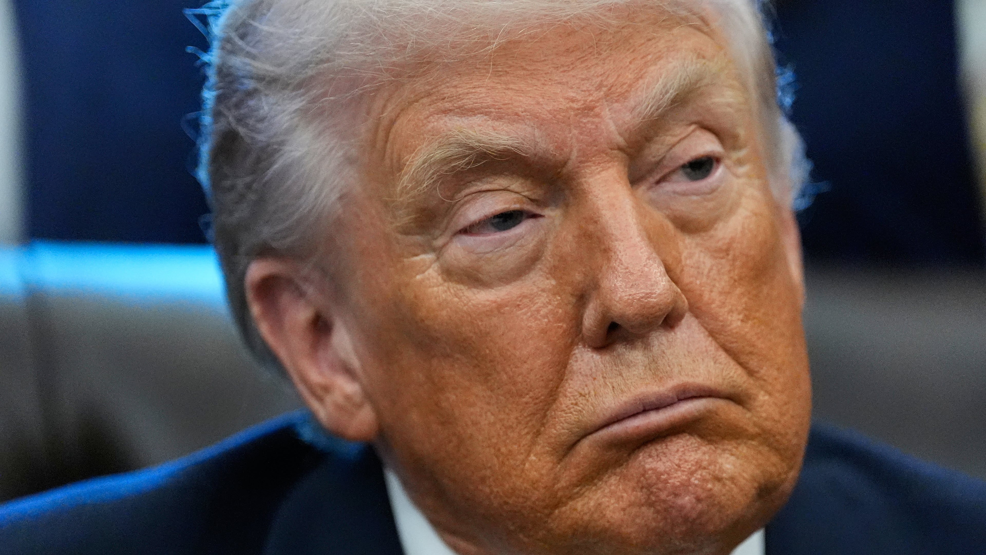 President Donald Trump listens in the Oval Office of the White House, Wednesday, Jan. 14, 2026, in Washington. (AP Photo/Alex Brandon)