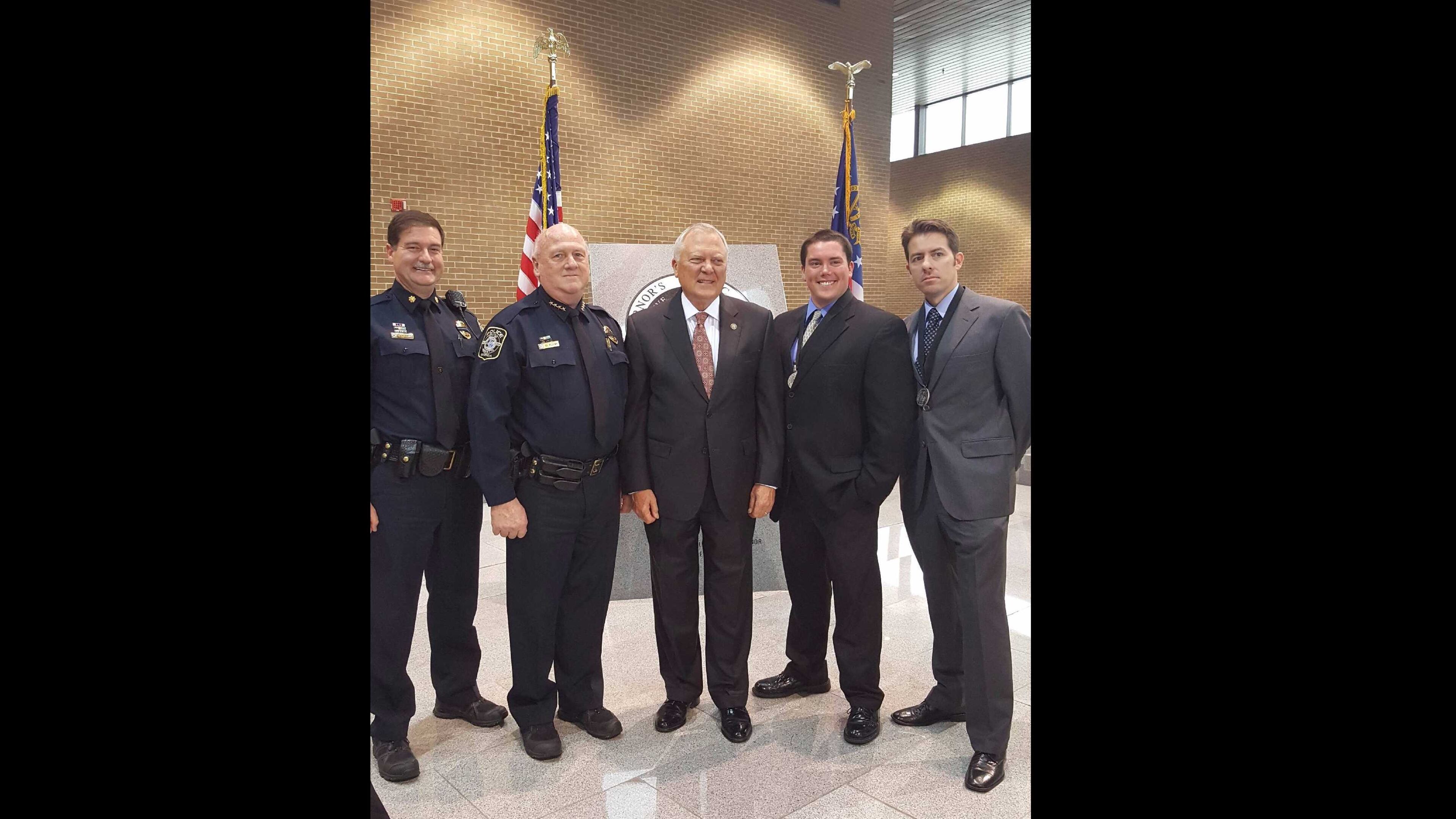 (Left to right) Marietta police Maj. Steve Kish, Chief Dan Flynn, Gov. Nathan Deal, officer Jayson Duncan and officer Enrique Mallen. Deal awarded the Marietta police officers Duncan and Mallen with the 2016 Governor’s Public Safety Award.