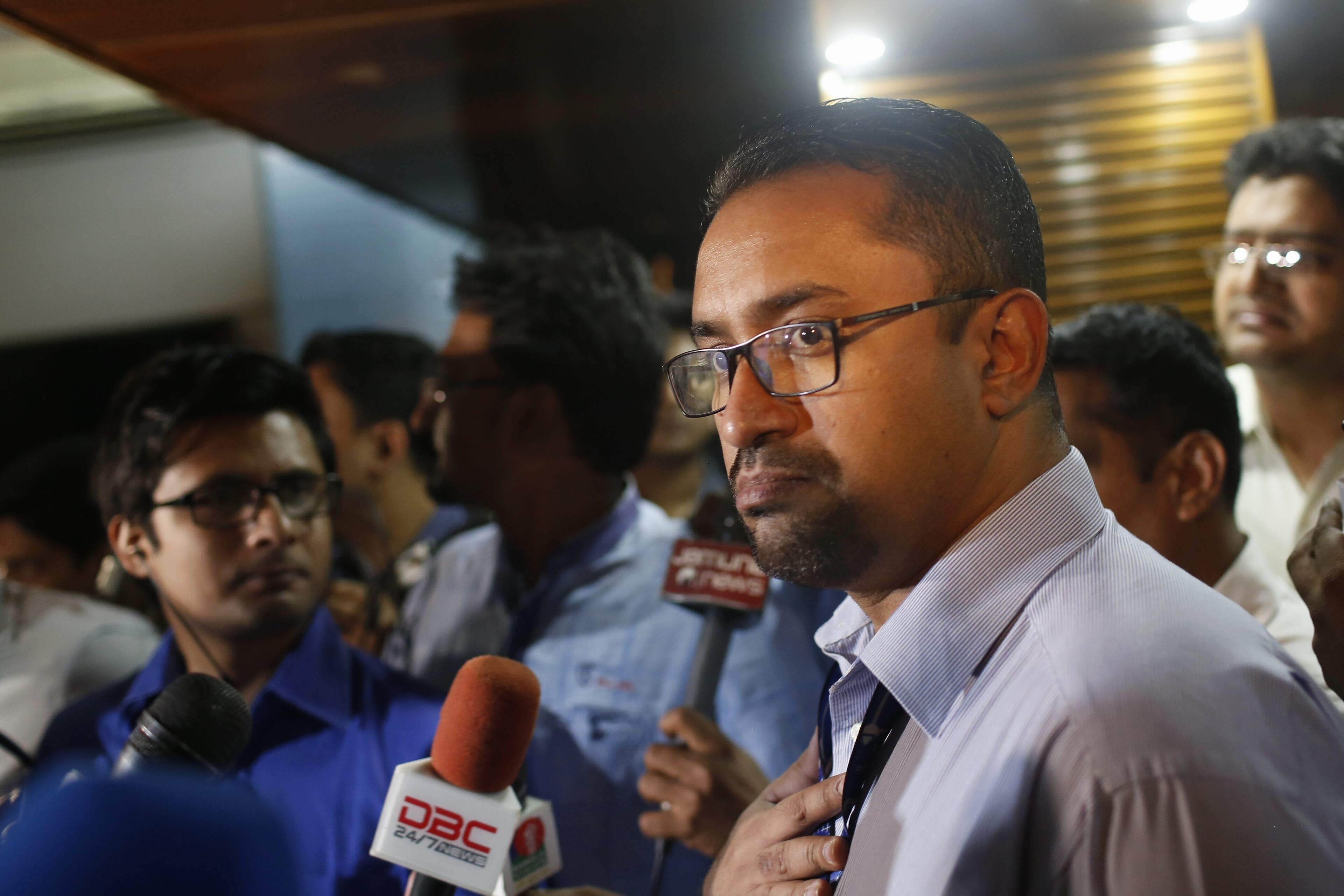 US-Bangla Airlines CEO Imran Asif talks to the media at the airline office in Dhaka, Bangladesh, Monday, March 12, 2018. A passenger plane carrying 71 people from Bangladesh crashed and burst into flames as it landed Monday in Kathmandu, Nepal's capital, killing dozens of people, officials said. (AP Photo/A.M. Ahad)