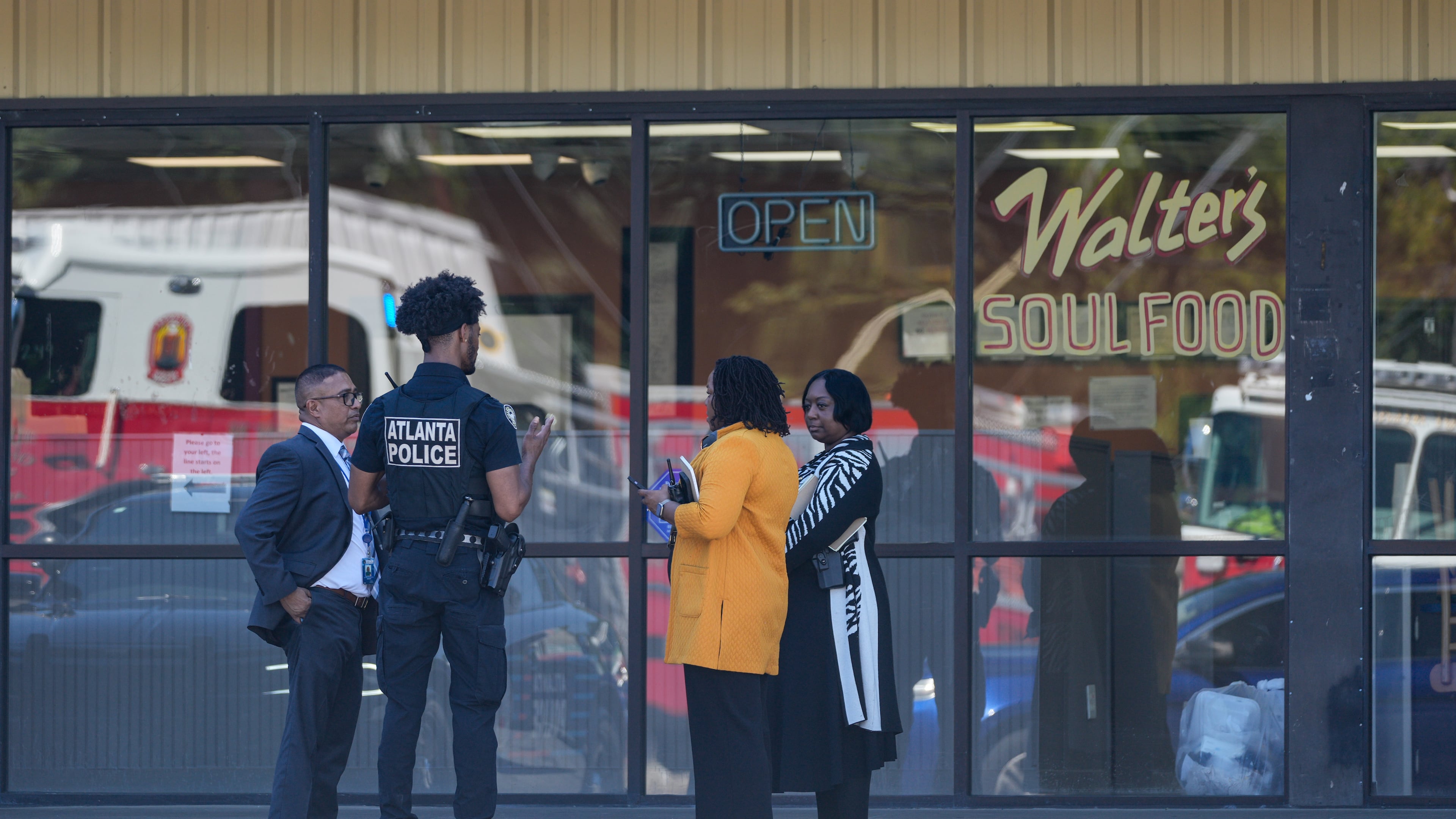 Atlanta police and homicide detectives stand outside Walter’s Soul Food Cafe after a body was found at the restaurant on Monday, Sept. 14, 2026. (Ben Hendren for the AJC)