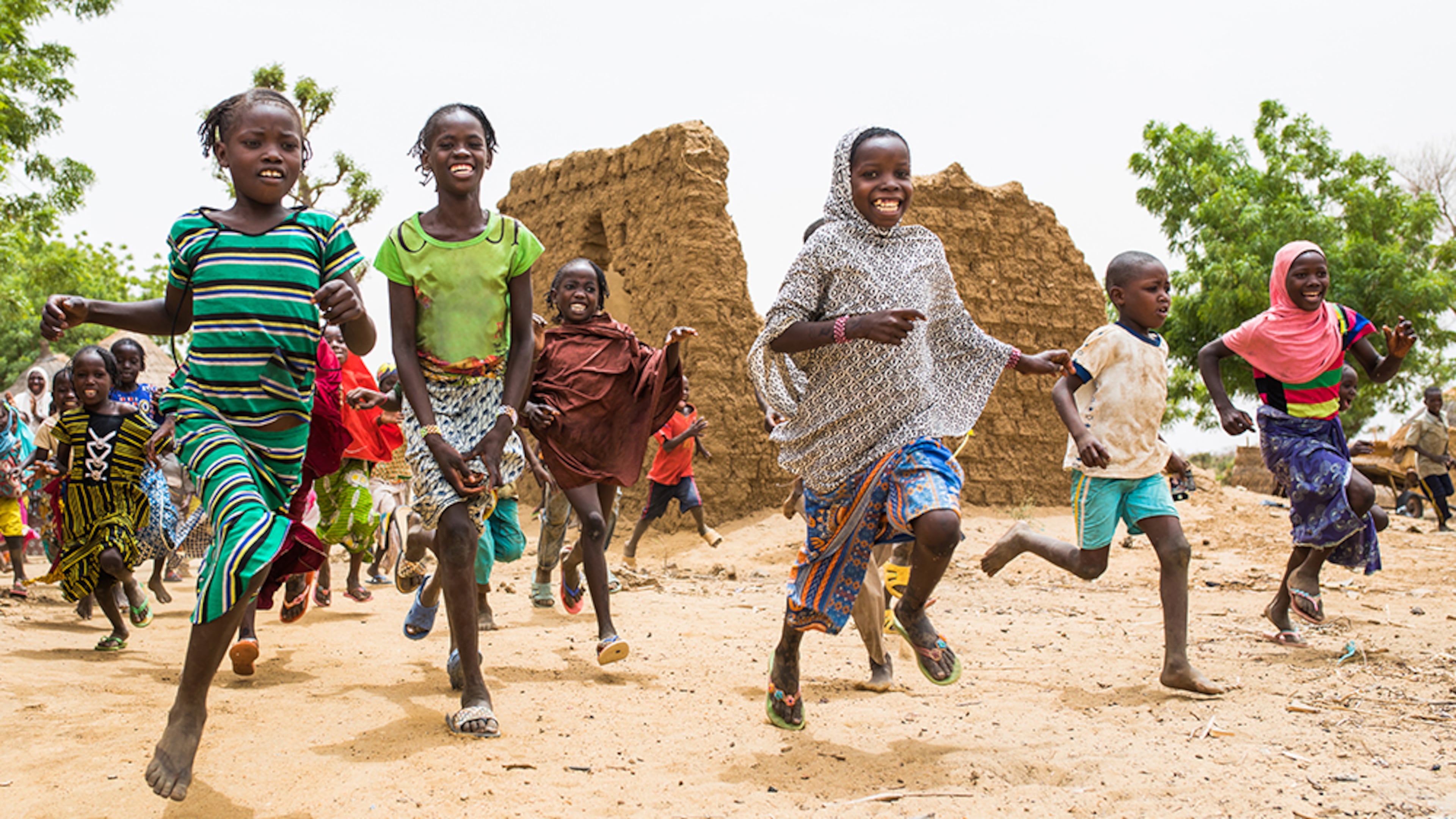 Children play near a routine check-in for the ongoing Mordor study in Mounbena, Niger on June 21, 2018.
Edited in Photoshop by Andi Counts for child safeguarding reasons