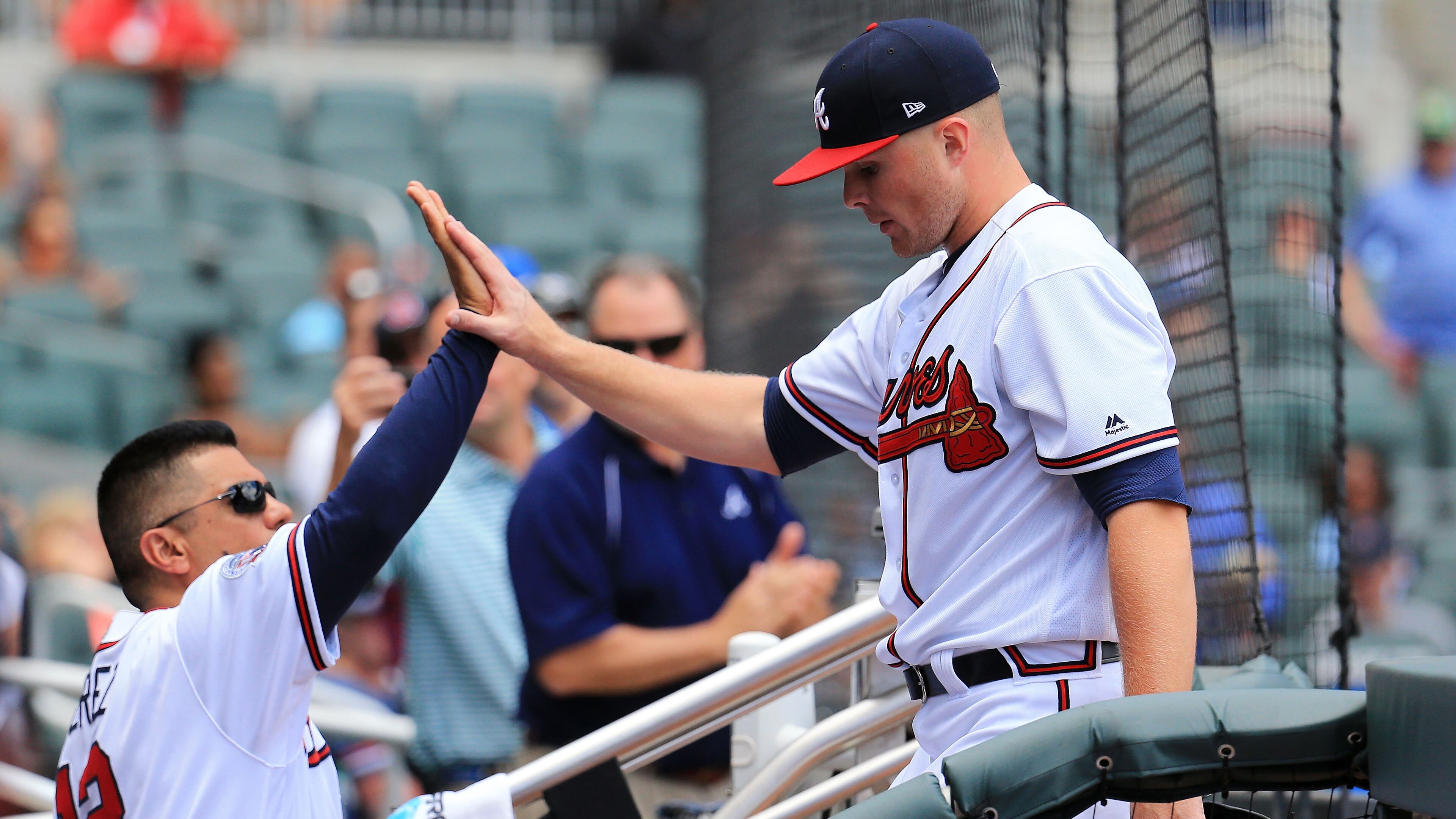 ATLANTA, GA - JUNE 10: Sean Newcomb #51 of the Atlanta Braves celebrates with first base coach Eddie Perez #12 after coming out in the seventh inning against the New York Mets at SunTrust Park on June 10, 2017 in Atlanta, Georgia. (Photo by Daniel Shirey/Getty Images)
