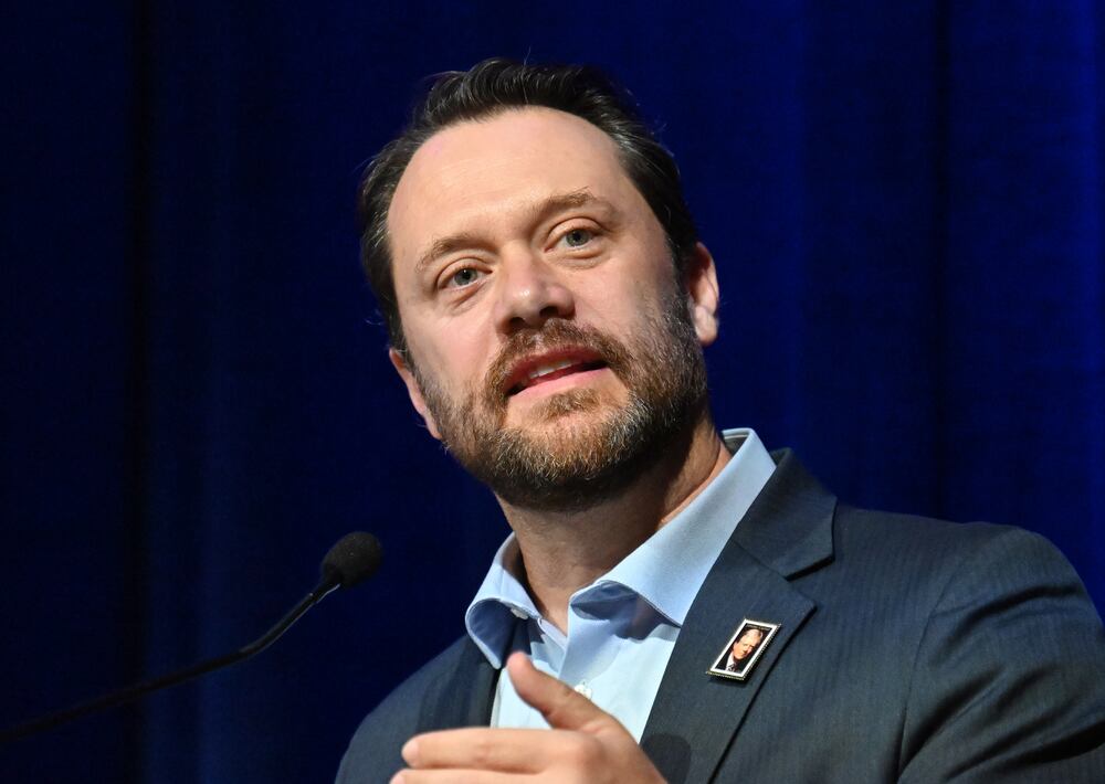 Jason Carter, former President Jimmy Carters grandson, speaks during the unveiling of the Jimmy Carter "forever" stamp in October 2025. (Hyosub Shin/AJC)