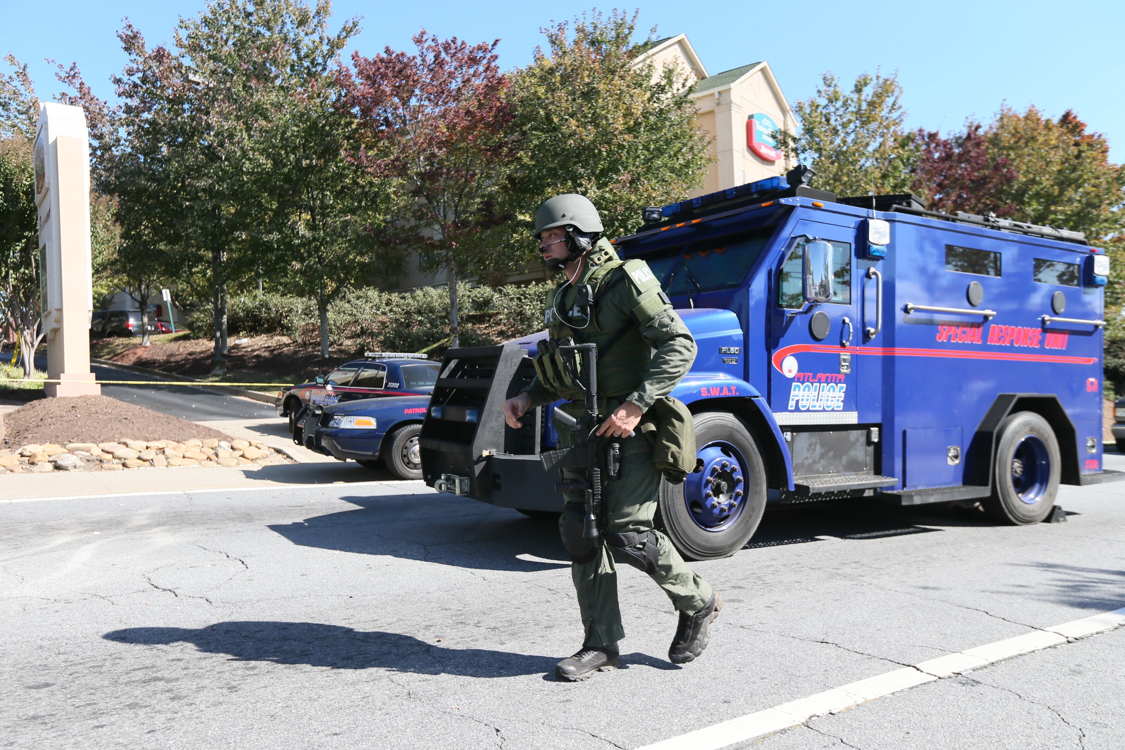 A burglary suspect surrendered to Atlanta police Thursday on the second floor of a Buckhead hotel that had been evacuated during a manhunt. The Towne Place Suites hotel at 800 Sidney Marcus Blvd. was evacuated just before the lunch hour as authorities, including a SWAT team, searched for the unidentified man.