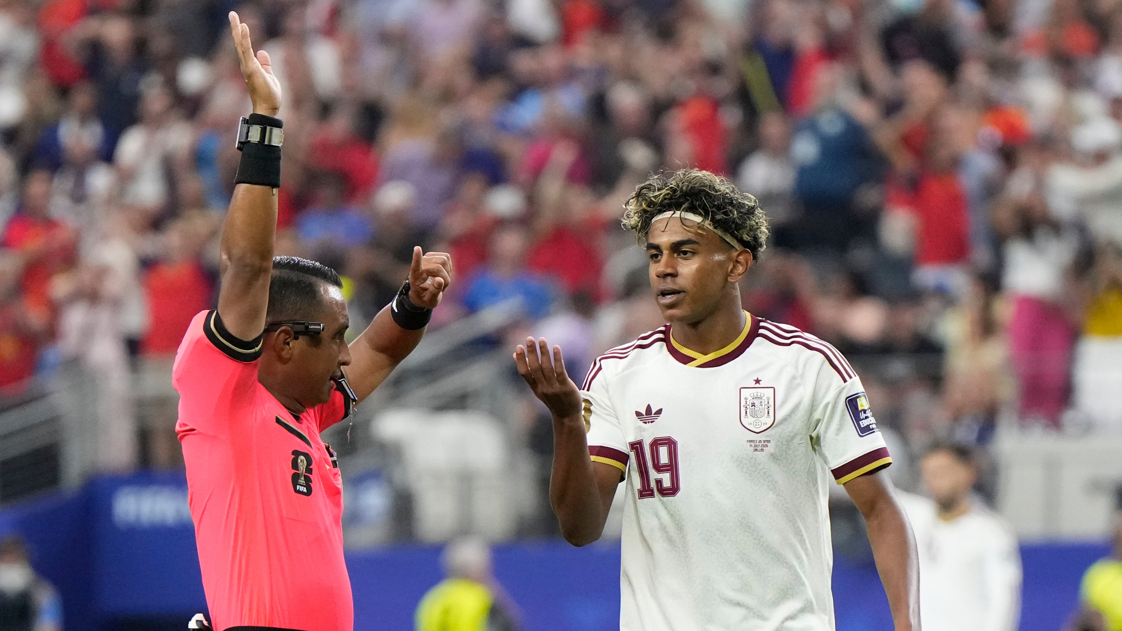 Referee Ivan Barton, of El Salvador, gestures to Spain's Lamine Yamal during the World Cup semifinal soccer match between France and Spain in Arlington, Texas, near Dallas, Tuesday, July 14, 2026. (AP Photo/Ashley Landis)