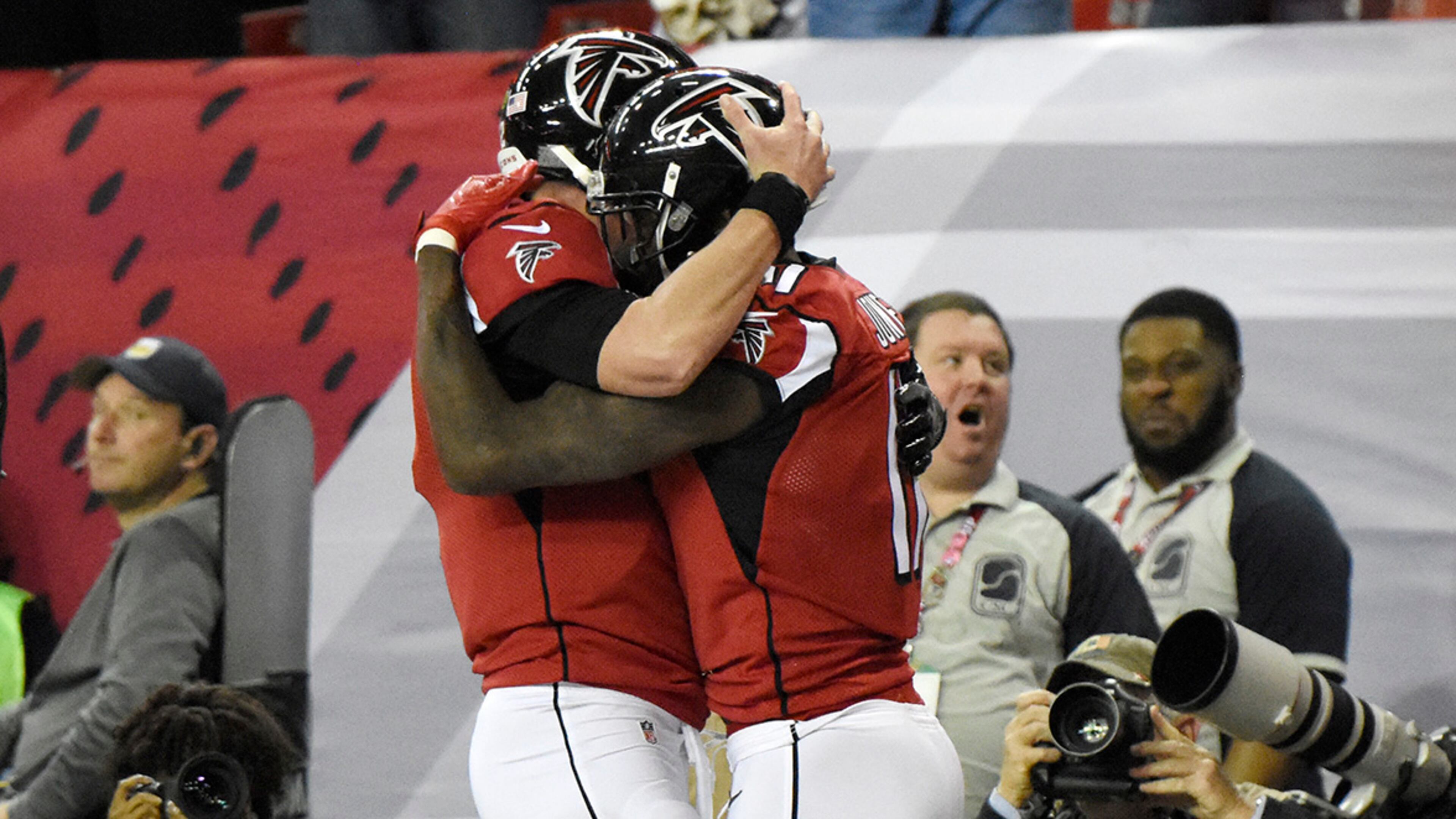 Falcons wide receiver Julio Jones (11) celebrates with quarterback Matt Ryan (2) after scoring a touchdown during the first half against the Saints Sunday, Jan. 1, 2017, at the Georgia Dome in Atlanta.