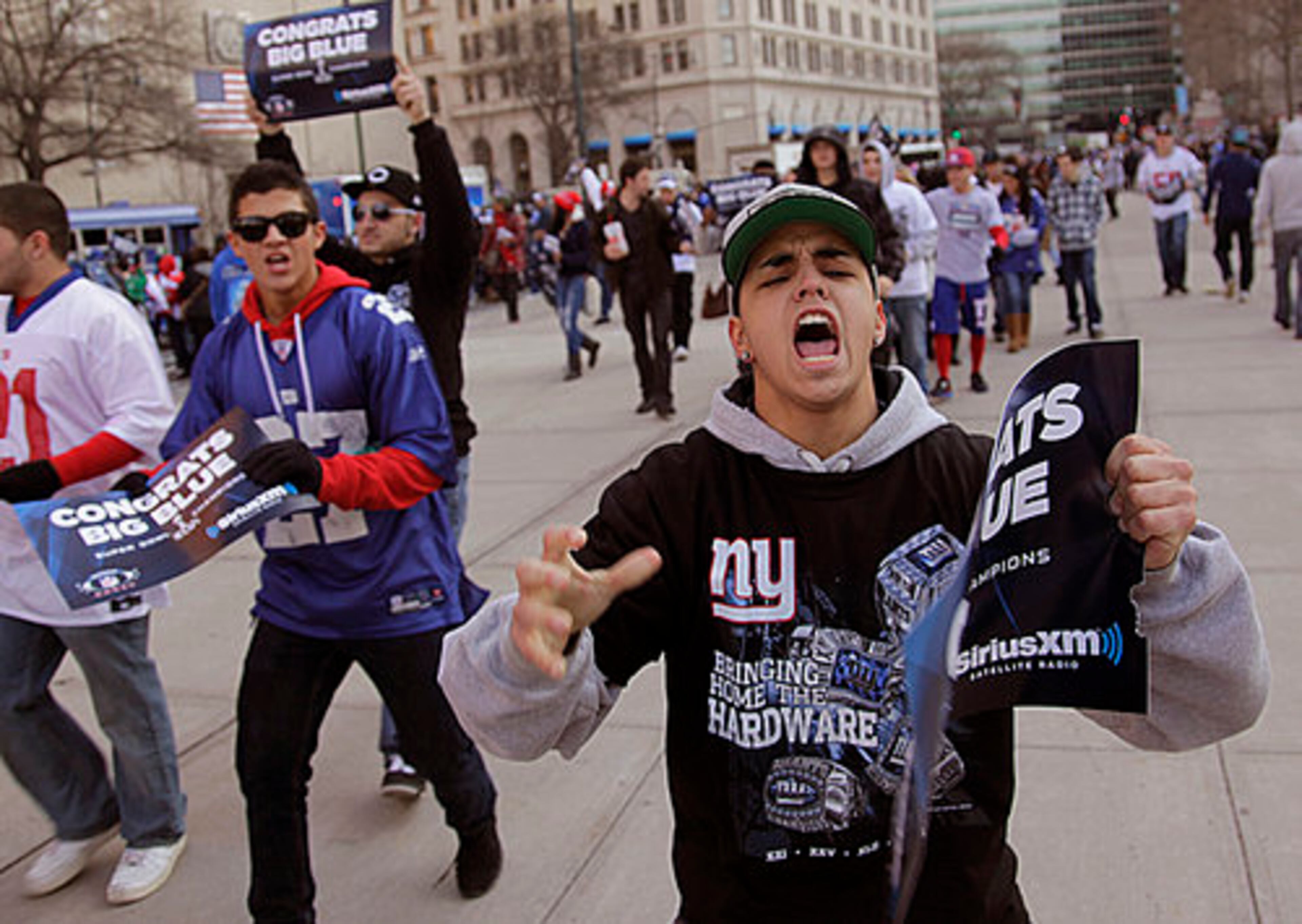 Fans cheer as they arrive in lower Manhattan for the start of the New York Giants Super Bowl parade.
