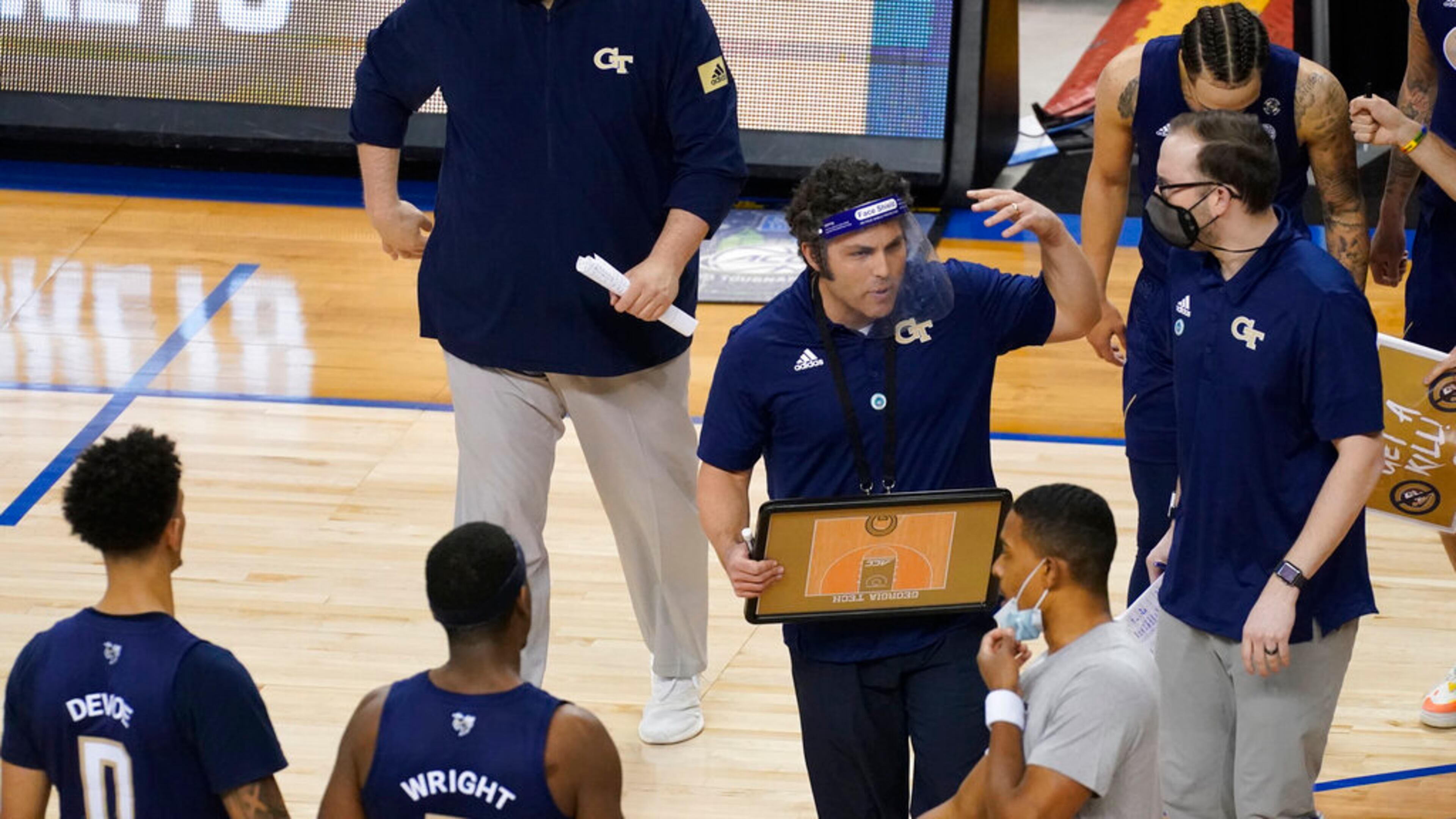 Georgia Tech head coach Josh Pastner (center) gathers his team during the second half of the ACC Championship game against Florida State in Greensboro, N.C., Saturday, March 13, 2021. (Gerry Broome/AP)
