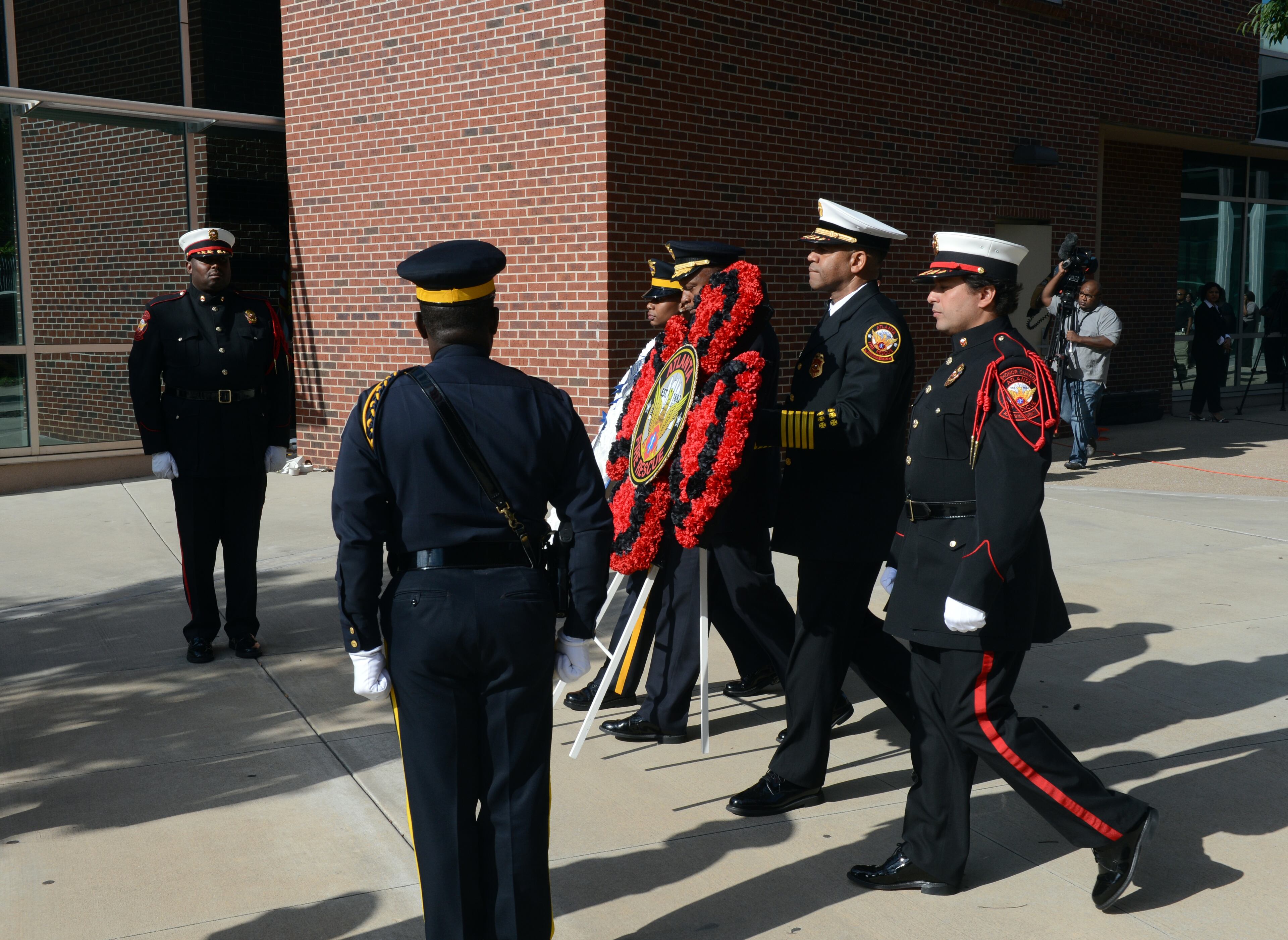 Atlanta Police Chief George Turner and Atlanta Fire Rescue Chief Kelvin J. Cochran lay a wreath during a ceremony with members of the AFR and APD color guard.