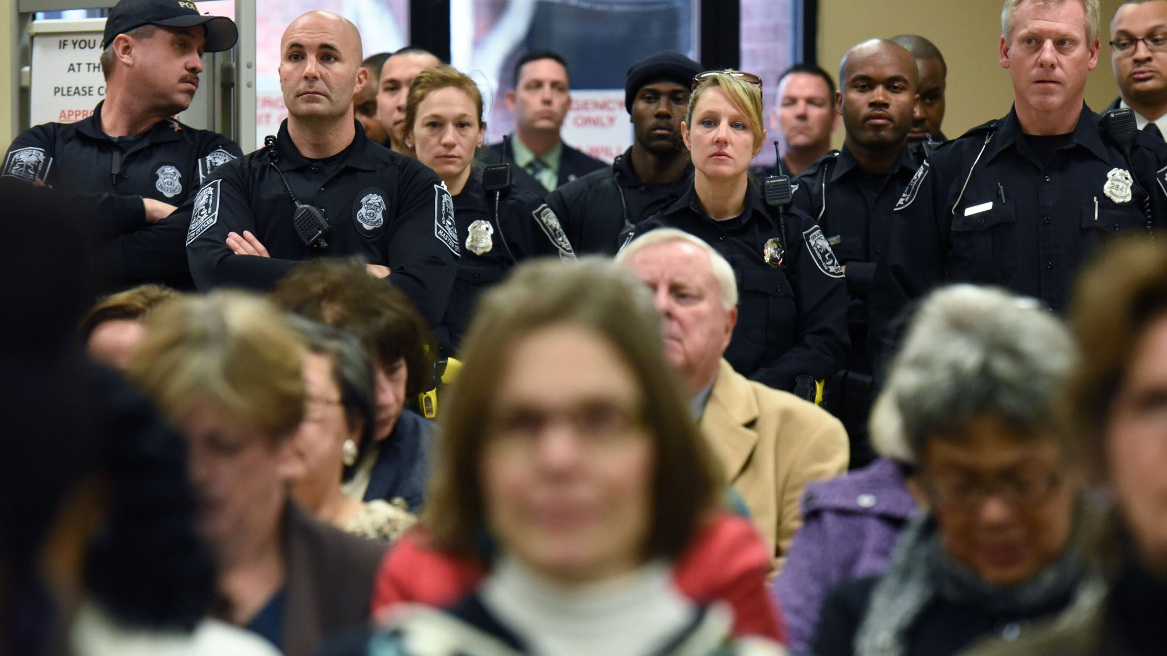 Police officers and other government employees packed the DeKalb County Commission meeting as they urged elected officials to approve pay raises Thursday. HYOSUB SHIN / HSHIN@AJC.COM